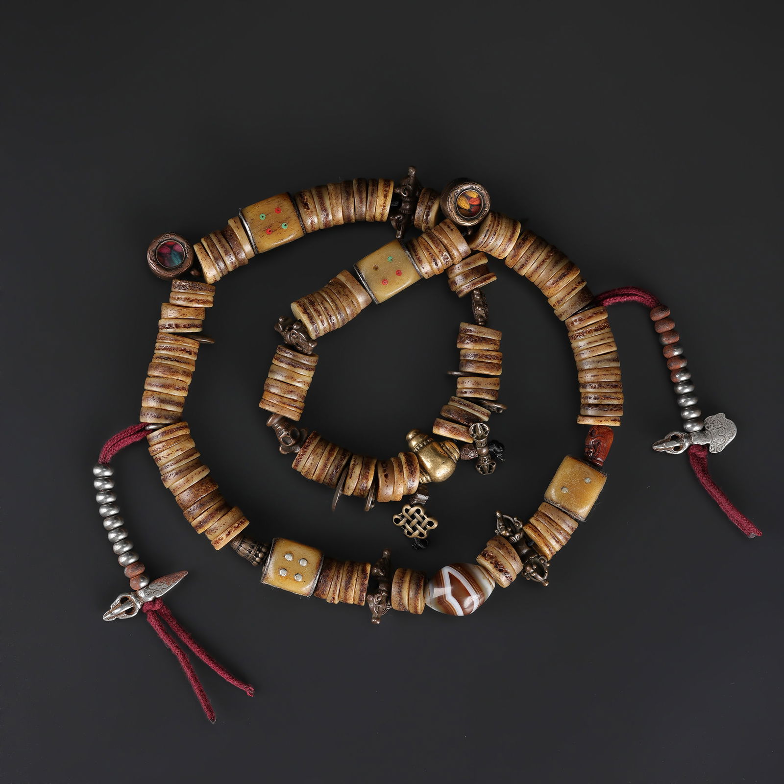 Tibetan Ritual Prayer Beads (Mala) of Yak Bone with Bronze Amulets: Traditional Tibetan Buddhist prayer mala featuring carved yak bone beads accented with bronze amulets. Used in ritual practice for mantra recitation and meditation. Total Weight: 352gram
