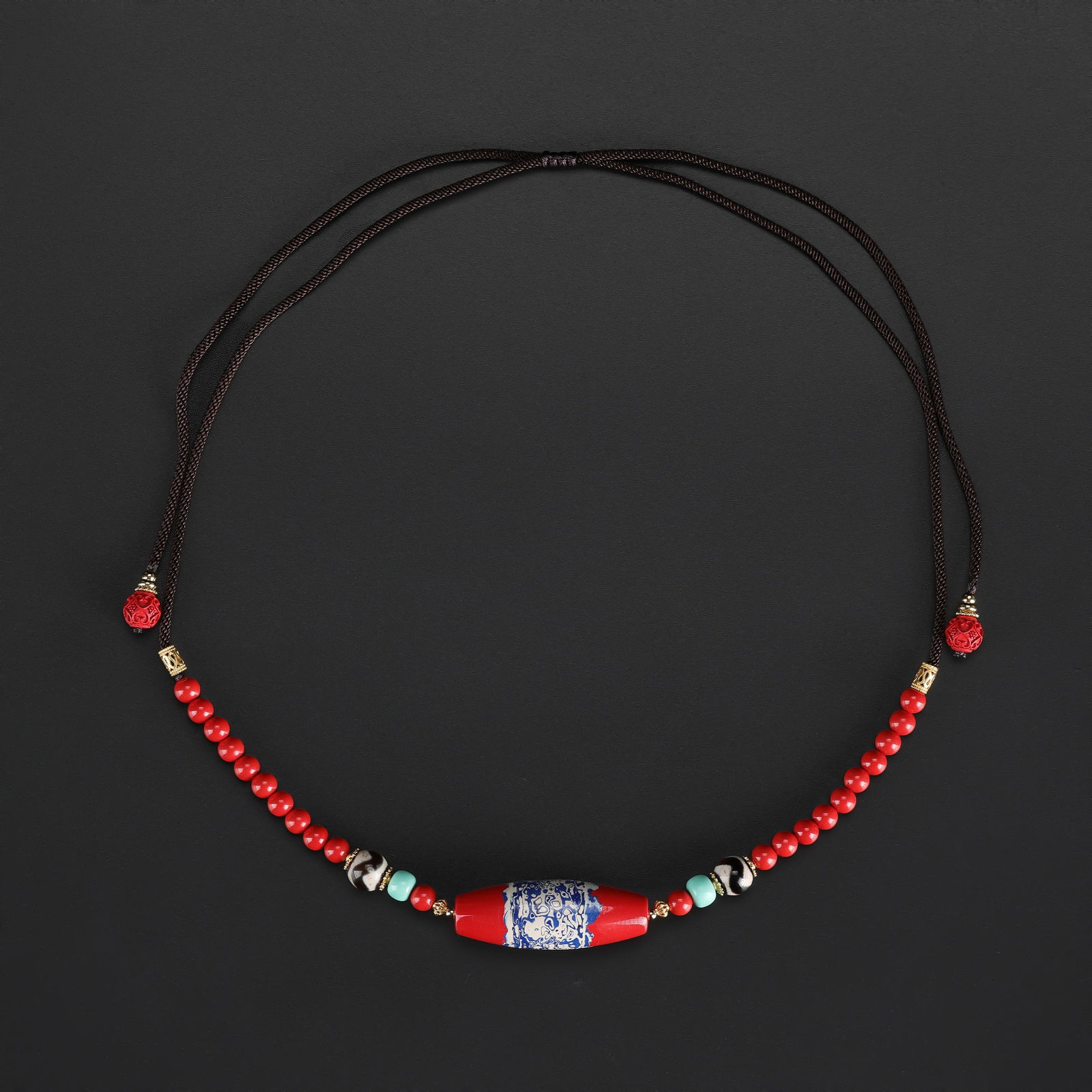 Vintage Red Millefiori Glass Pendant Necklace Accented with Dzi Beads: Vintage necklace featuring a striking red millefiori glass pendant, accented with traditional Tibetan Dzi beads. Total Weight: 30gram