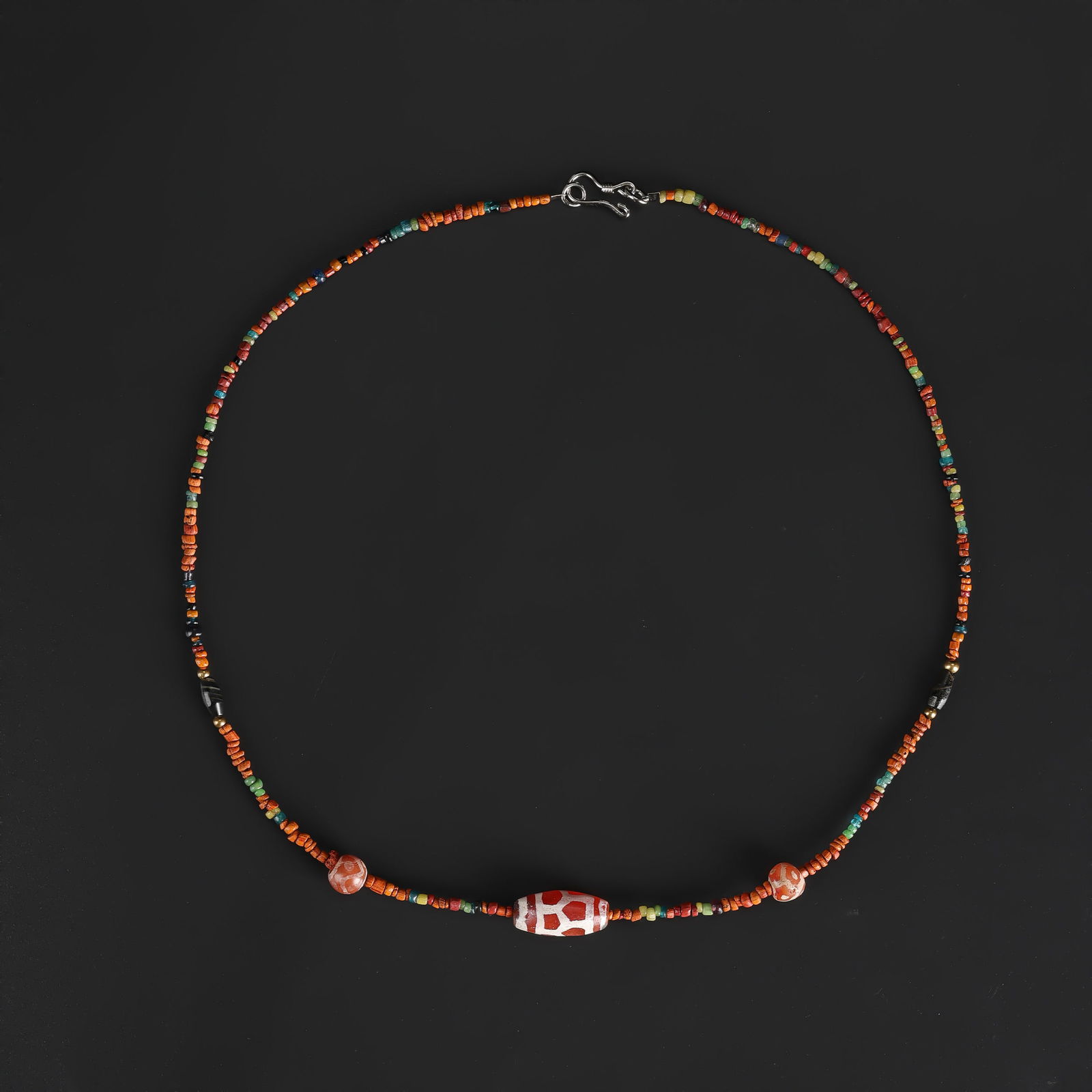Antique Mixed Etched Carnelian and Ancient Glass Beads Necklace: Antique necklace featuring a mix of etched carnelian and ancient glass beads, carefully strung to create a harmonious and visually striking design. Length: 18in Total Weight: 7gram