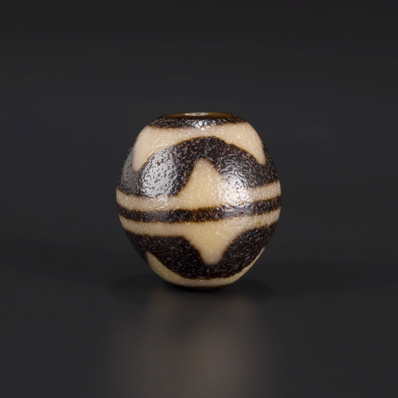 Tibetan Double Tiger Teeth Agate Dzi Bead: Tibetan Double Tiger Teeth Agate Dzi Bead Size Detail: 2.4cm Weight: 16gram