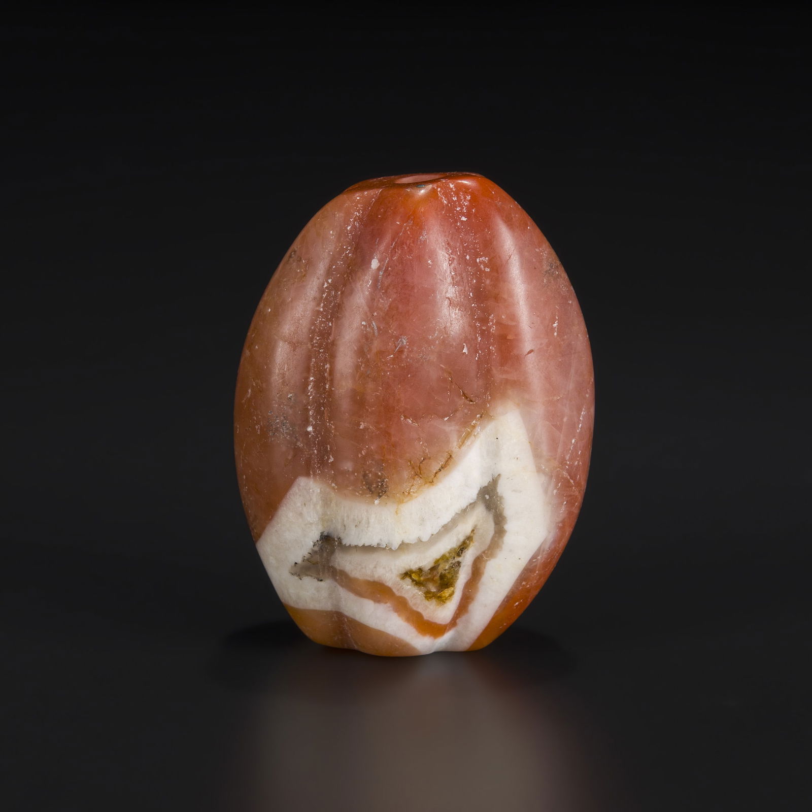Himalayan Melon-Cut Pema Raka Carnelian Agate Bead: Himalayan Melon-Cut Pema Raka Carnelian Agate Bead Size Detail: 4.4 x 5.9cm Weight: 129gram