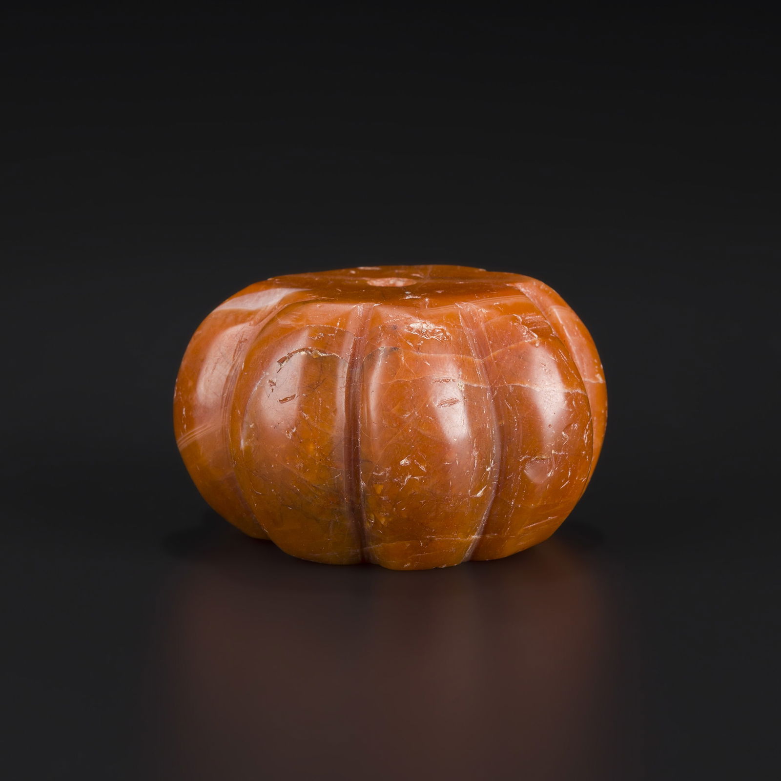 Himalayan Melon-Cut Pema Raka Carnelian Agate Bead: Himalayan Melon-Cut Pema Raka Carnelian Agate Bead Size Detail: 5.8 x 3.5cm Weight: 168gram