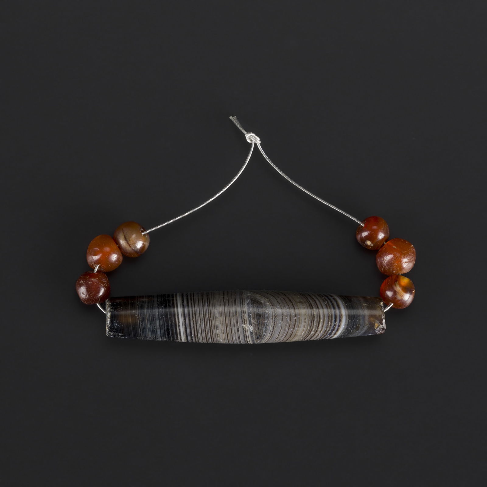 Collection of Banded Agate Long Bead with Old Round Carnelian Beads: Collection of Banded Agate Long Bead with Old Round Carnelian Beads. Total Weight: 12gram
