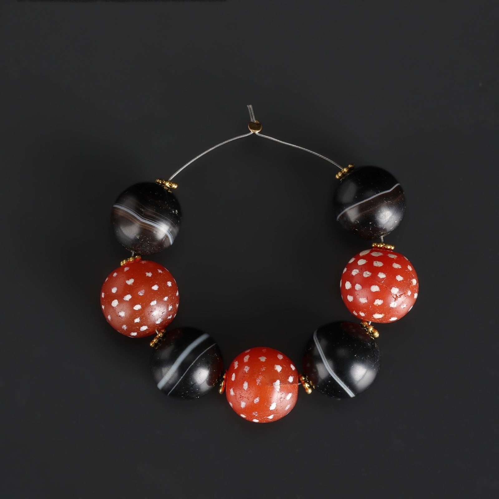 Lot of Himalayan Etched Carnelian Beads with Spot Design and Babagoria Banded Agate Rami Beads: A lot of Himalayan beads featuring etched carnelian with distinctive spot designs, accompanied by Babagoria-style banded agate rami beads. Total Weight: 45gram