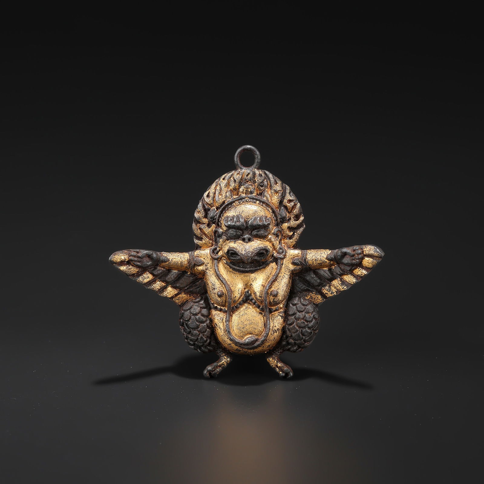 Antique Tibetan Gilt-Bronze Garuda Amulet, Himalayan Region: Antique Tibetan Gilt-Bronze Garuda Amulet, Himalayan Region. Size Details: 6.2 x 5.4cm Weight: 30gram