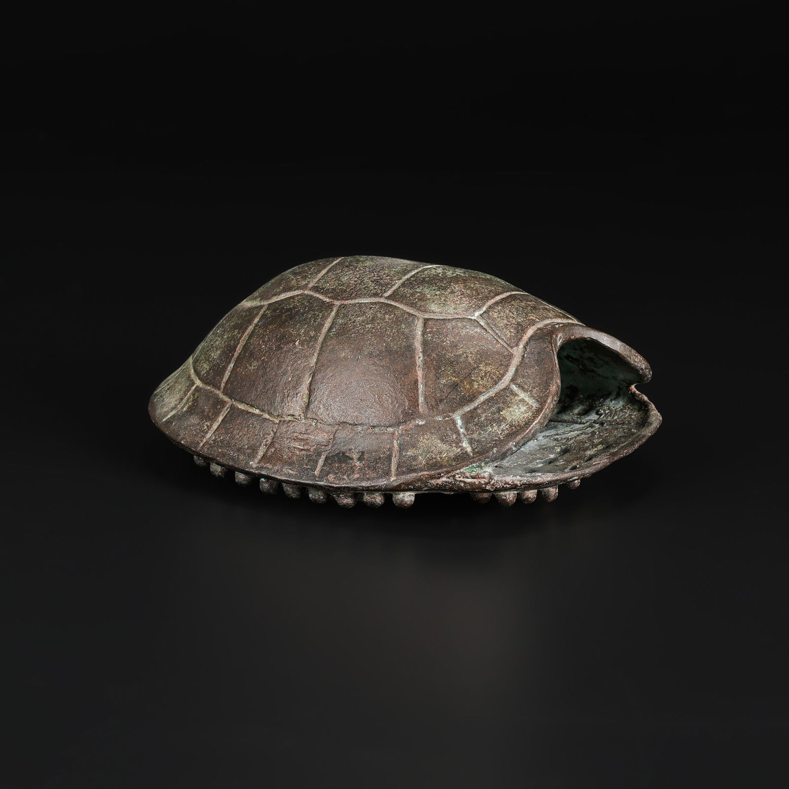 Antique Chinese Bronze Amulet Pendant with Turtle Shell Motif and Symbol: An antique Chinese amulet pendant cast in bronze, formed as a stylized turtle shell and centered with a symbolic motif. Size Detail: 10.8 x 13.5cm Weight: 426gram
