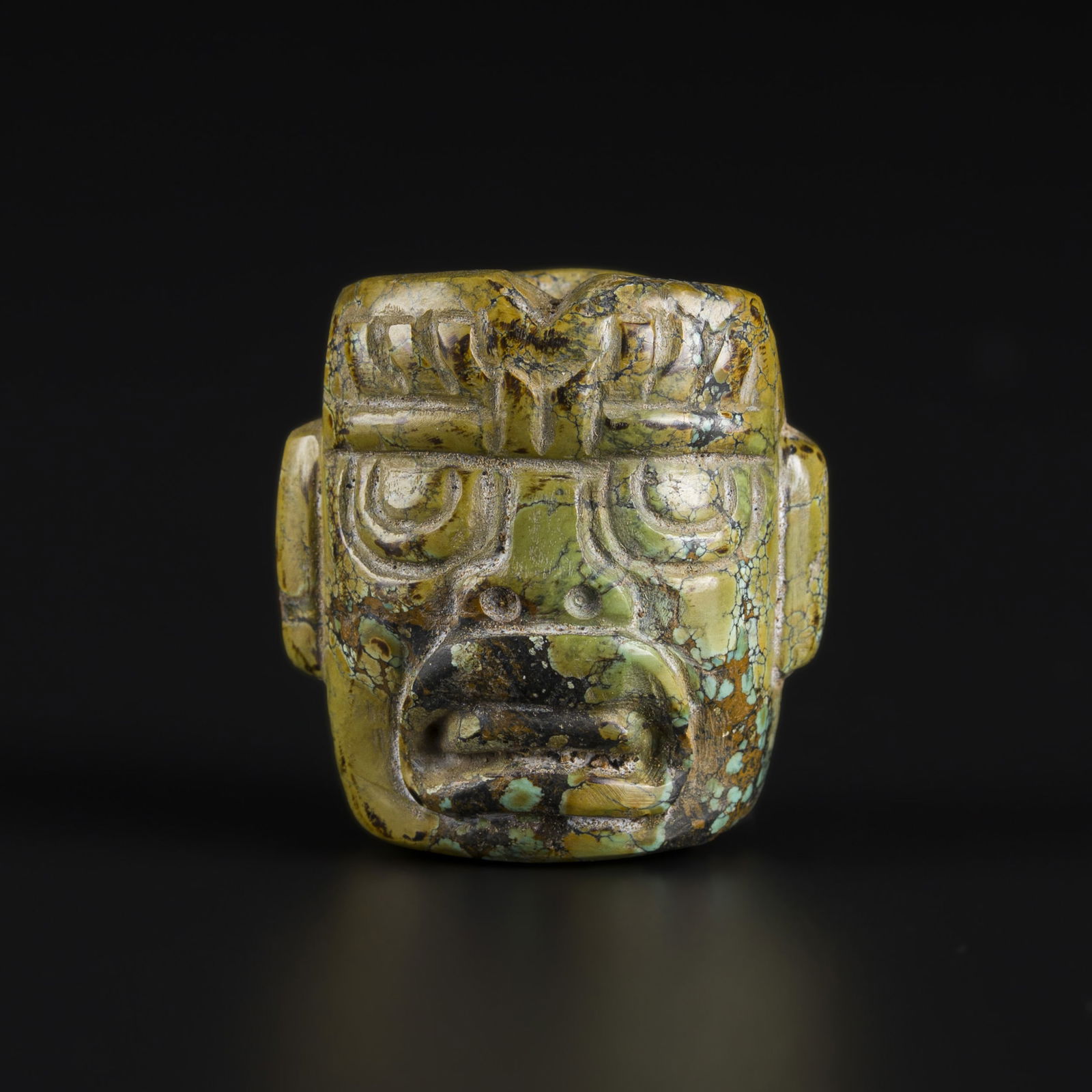 Neolithic Hongshan Turquoise Amulet Depicting Face Mask: Neolithic Hongshan Turquoise Amulet Depicting Face Mask. Size Detail: 2.5 x 2.7cm Weight: 20gram