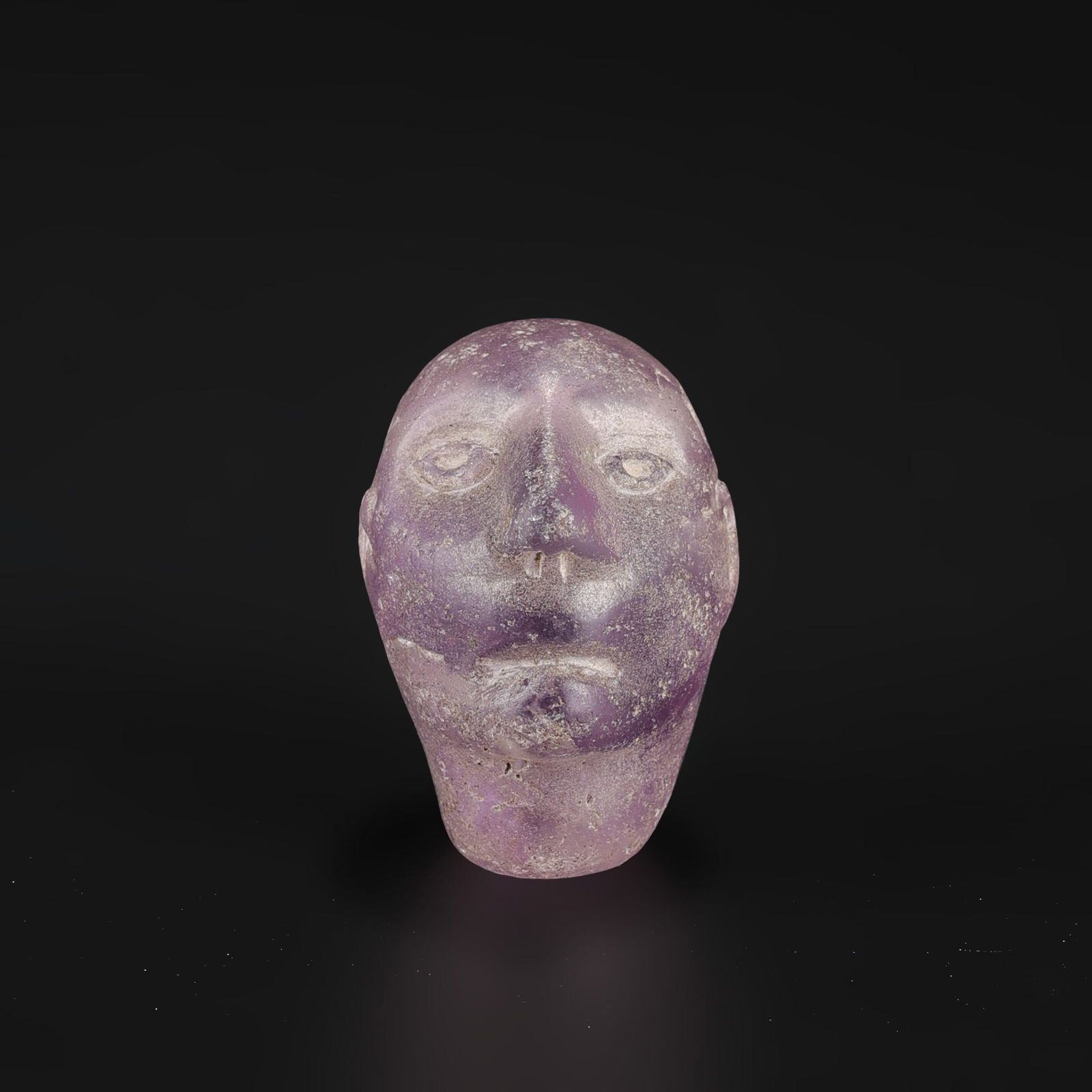 Near Eastern Bactrian Carved Amethyst Man-Head Figure Amulet Bead: Near Eastern Bactrian Carved Amethyst Man-Head Figure Amulet Bead Size Detail: 2.2 x 3.2cm Weight: 21gram