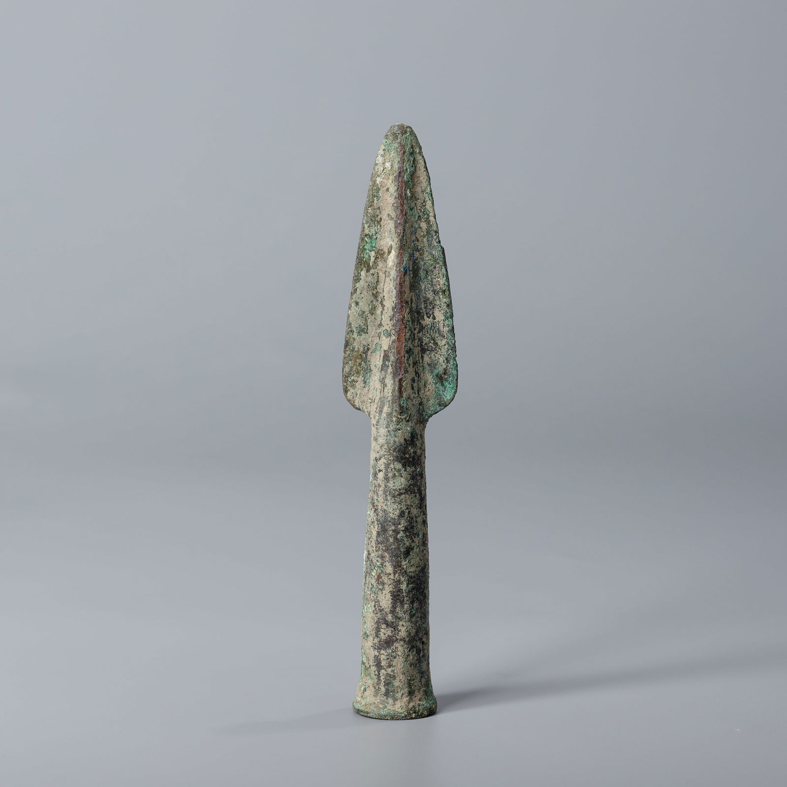 Antique Greek Greco-Bactrian Bronze Socketed Spear Head: Bronze socketed spear head dating from the Greek Greco-Bactrian period. Measuring 3 x 16 cm and weighing 123 grams, this antique piece features aged patina and fine craftsmanship.