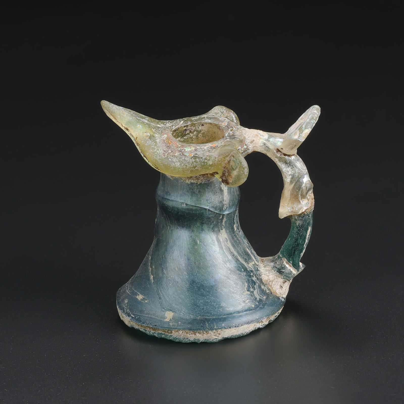 Ancient Roman Glass Unique Jug With Beautiful Patina: Ancient Roman Glass Unique Jug With Beautiful Patina Ancient Roman Glass Unique Jug With Beautiful Patina Size Details: 7.8 x 7.4cm Total Weight: 99gram