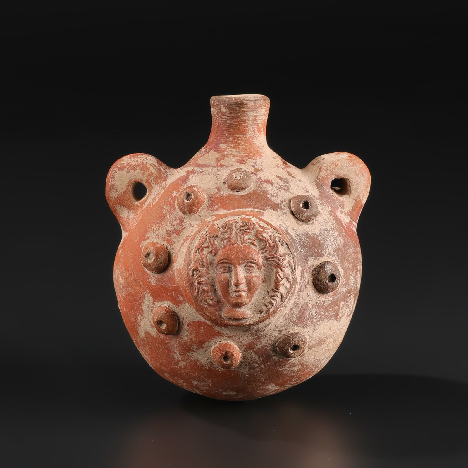Hellenistic Greek terracotta Ancient Pottery Vessel featuring the Head of Medusa: Hellenistic Greek terracotta Ancient Pottery Vessel featuring the Head of Medusa Size Detail: 9.5 x 13.5cm Weight: 384gram