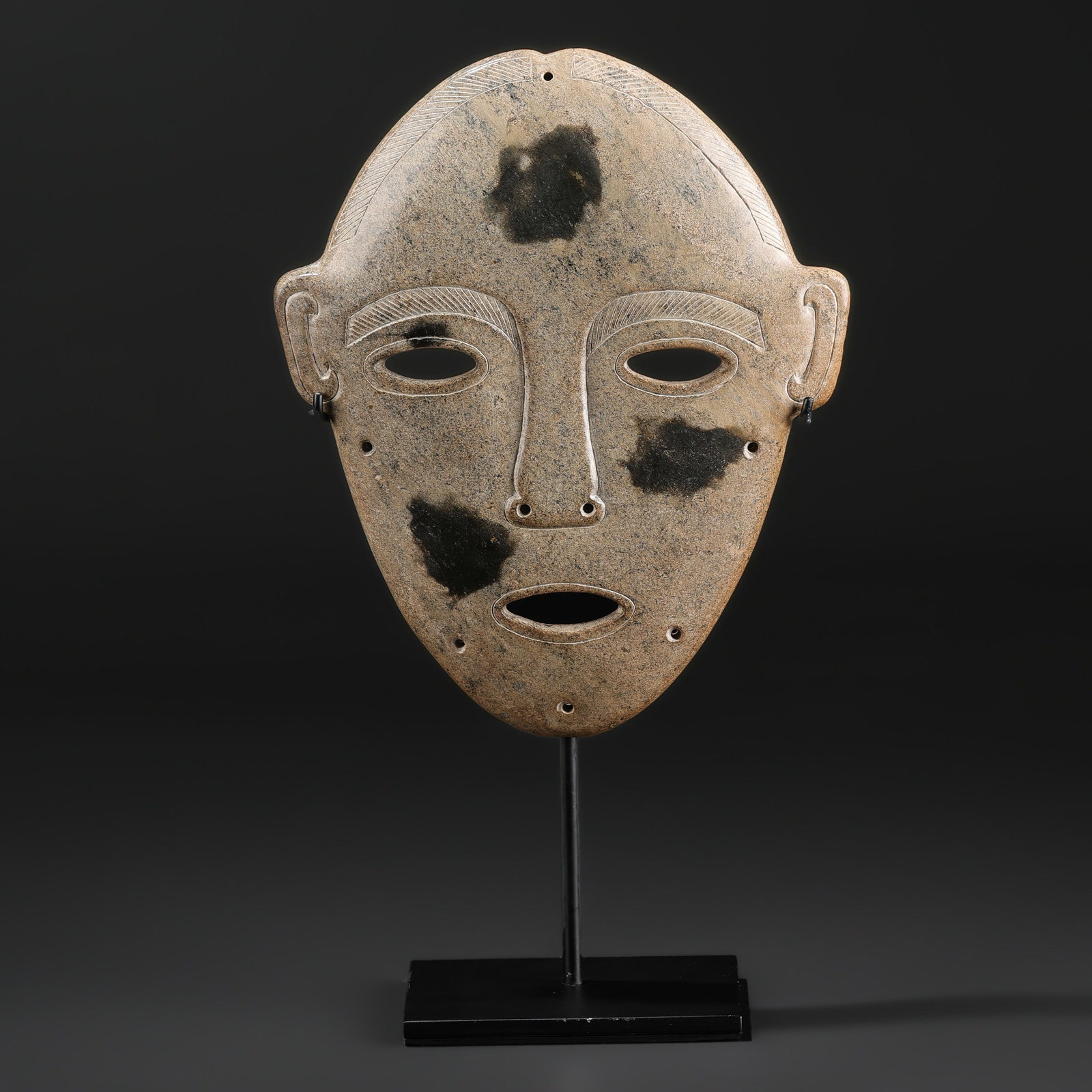 A Rare Grey Jade Mask of a Human Face (1 of 5)