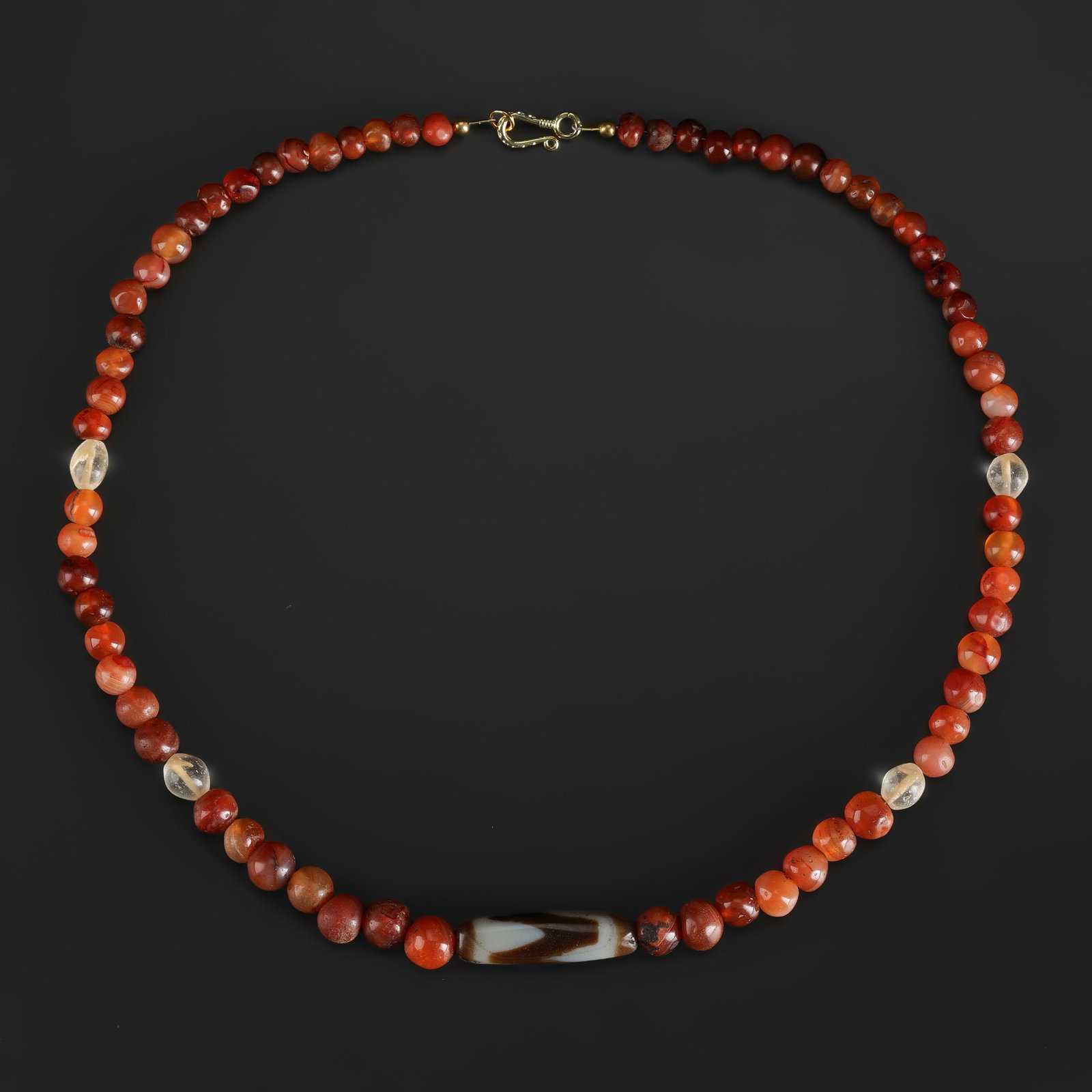 Necklace of Carnelain Beads with Tiger Teeth Dzi Bead Pendant: Necklace of Carnelain Beads with Tiger Teeth Dzi Bead Pendant Length: 20in Total Weight: 61gram