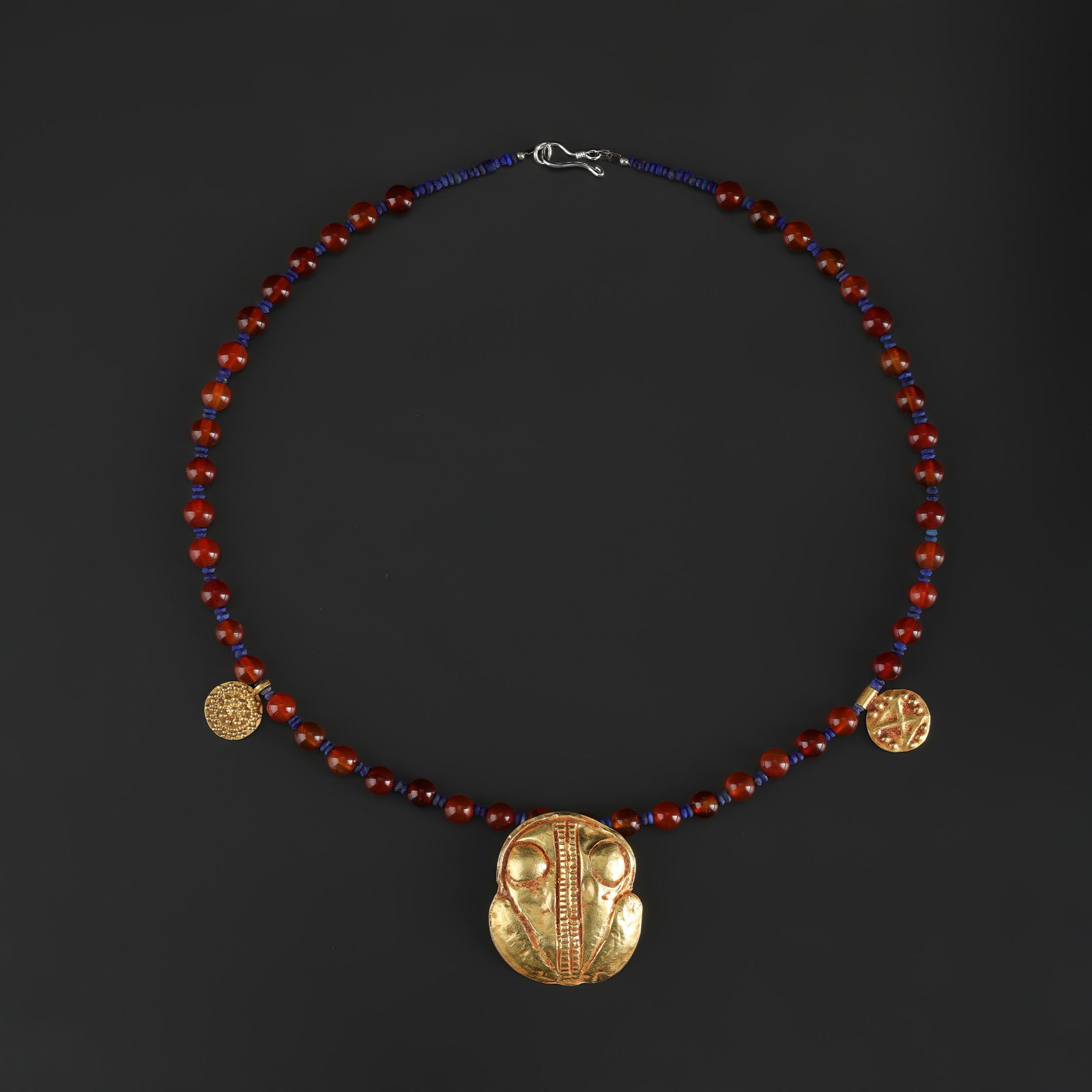 Ancient Carnelian Beads Necklace with 18K Gold Amulet and Coins Pendant: Fine Gold Ancient Carnelian Beads Necklace with 18K Gold Amulet and Coins Pendant. A desirable auction piece with strong decorative presence and fine gold craftsmanship. Well suited for ancient coin a