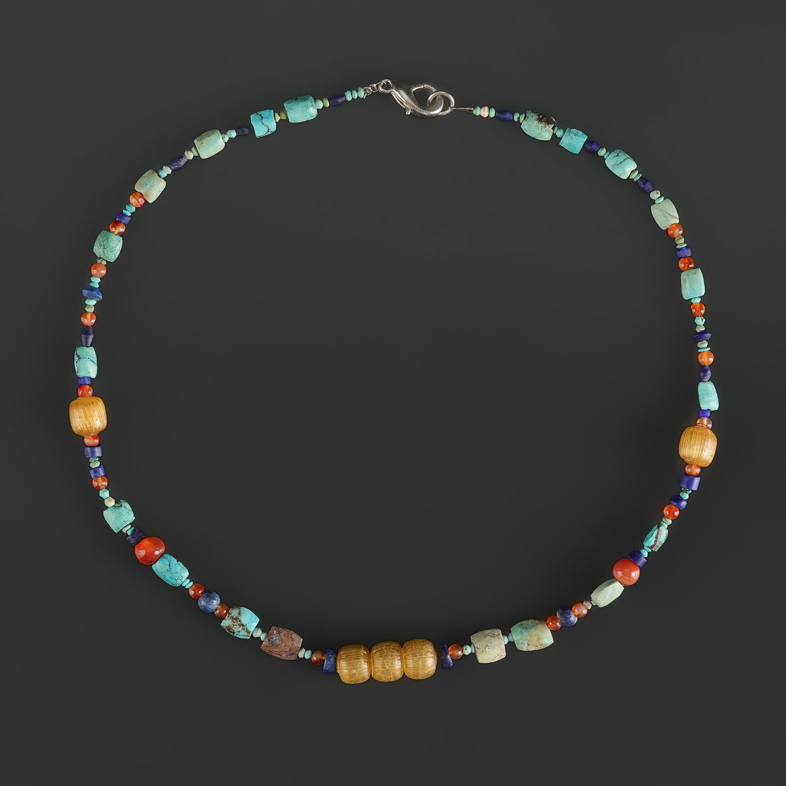 Collection of Antique Mix Turquoise, Carnelian, Lapis Lazuli, and Ancient Roman Glass Beads Necklace: Fine Bead Necklace Collection of Antique Mix Turquoise, Carnelian, Lapis Lazuli, and Ancient Roman Glass Beads Necklace. A desirable auction piece showing attractive natural color, texture, and charac