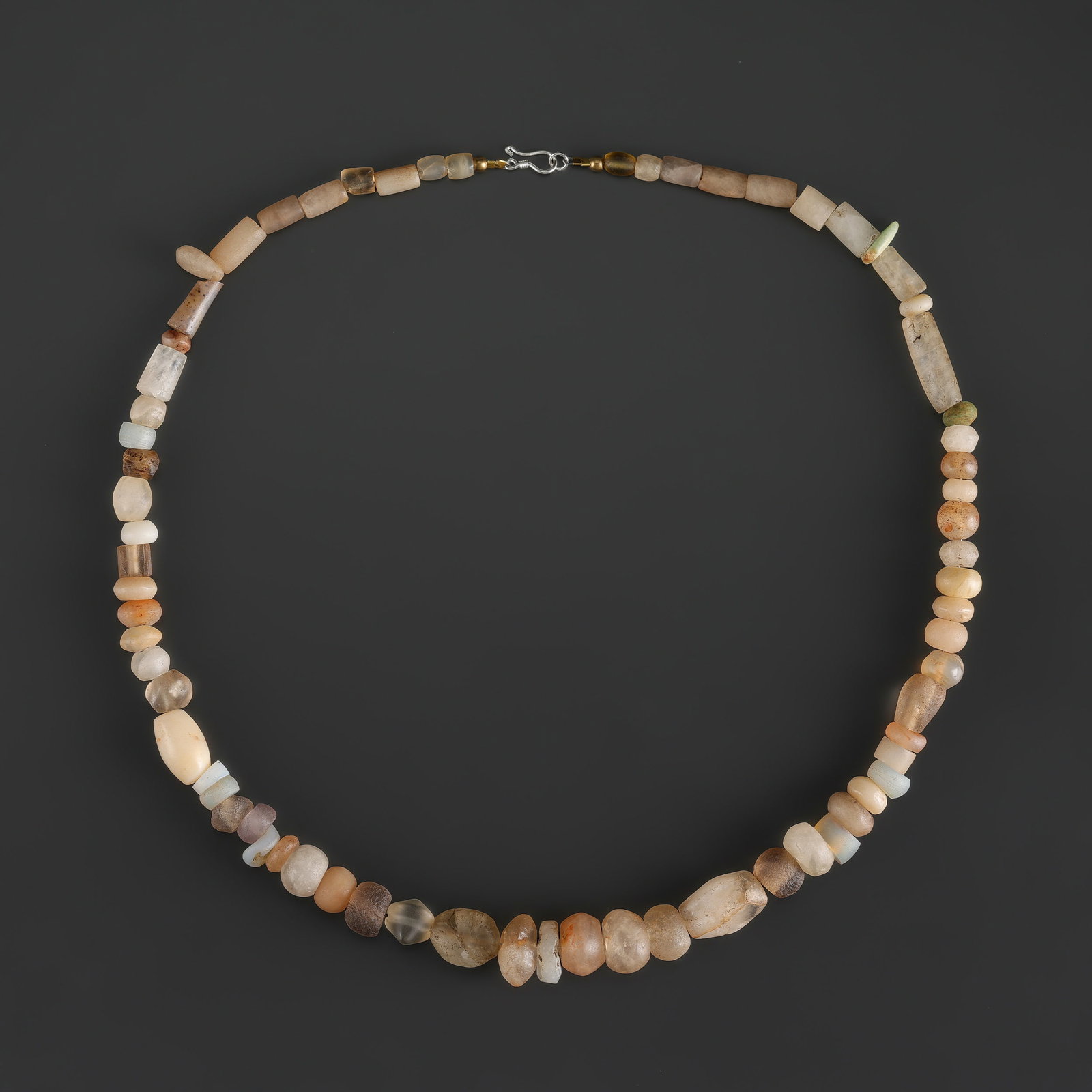Collection of Ancient Quartz Crystal Stone Beads Necklace: Fine Bead Necklace Collection of Ancient Quartz Crystal Stone Beads Necklace. A desirable auction piece showing attractive natural color, texture, and character. Well suited for ethnographic jewelry c