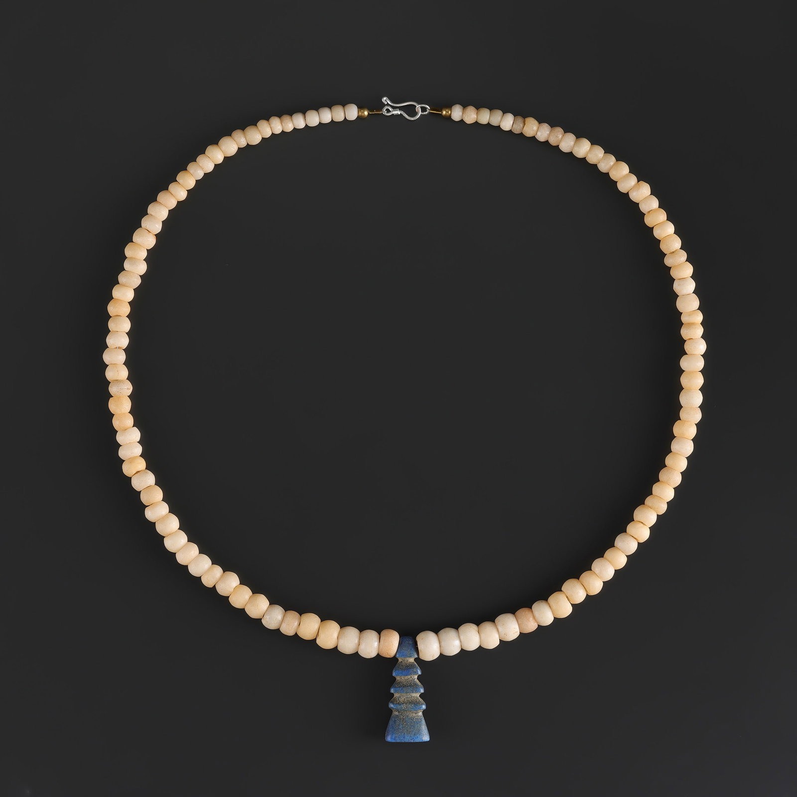 Collection Of White Agate Beads Neckalce with Lapis Lazuli Amulet Pendant: Fine Bead Necklace Collection Of White Agate Beads Neckalce with Lapis Lazuli Amulet Pendant. A desirable auction piece showing attractive natural color, texture, and character. Well suited for ethnog
