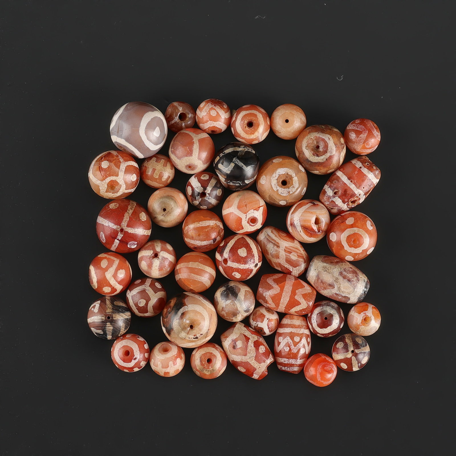 Collection of Antique Old Etched Carnellian Beads Lot: Fine Bead Group Collection of Antique Old Etched Carnellian Beads Lot. A desirable auction piece with appealing beadwork and collectible visual character. Well suited for ethnographic jewelry collecto
