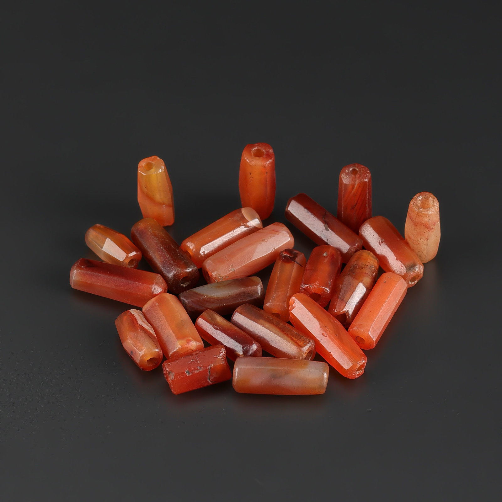 Antique Old Carnelian Agate Cylinder Beads: Fine Bead Group Antique Old Carnelian Agate Cylinder Beads. A desirable auction piece showing attractive natural color, texture, and character. Well suited for ethnographic jewelry collectors, display
