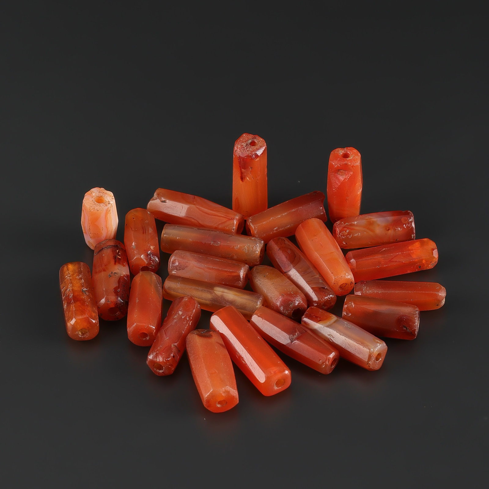 Antique Old Carnelian Agate Cylinder Beads: Fine Bead Group Antique Old Carnelian Agate Cylinder Beads. A desirable auction piece showing attractive natural color, texture, and character. Well suited for ethnographic jewelry collectors, display