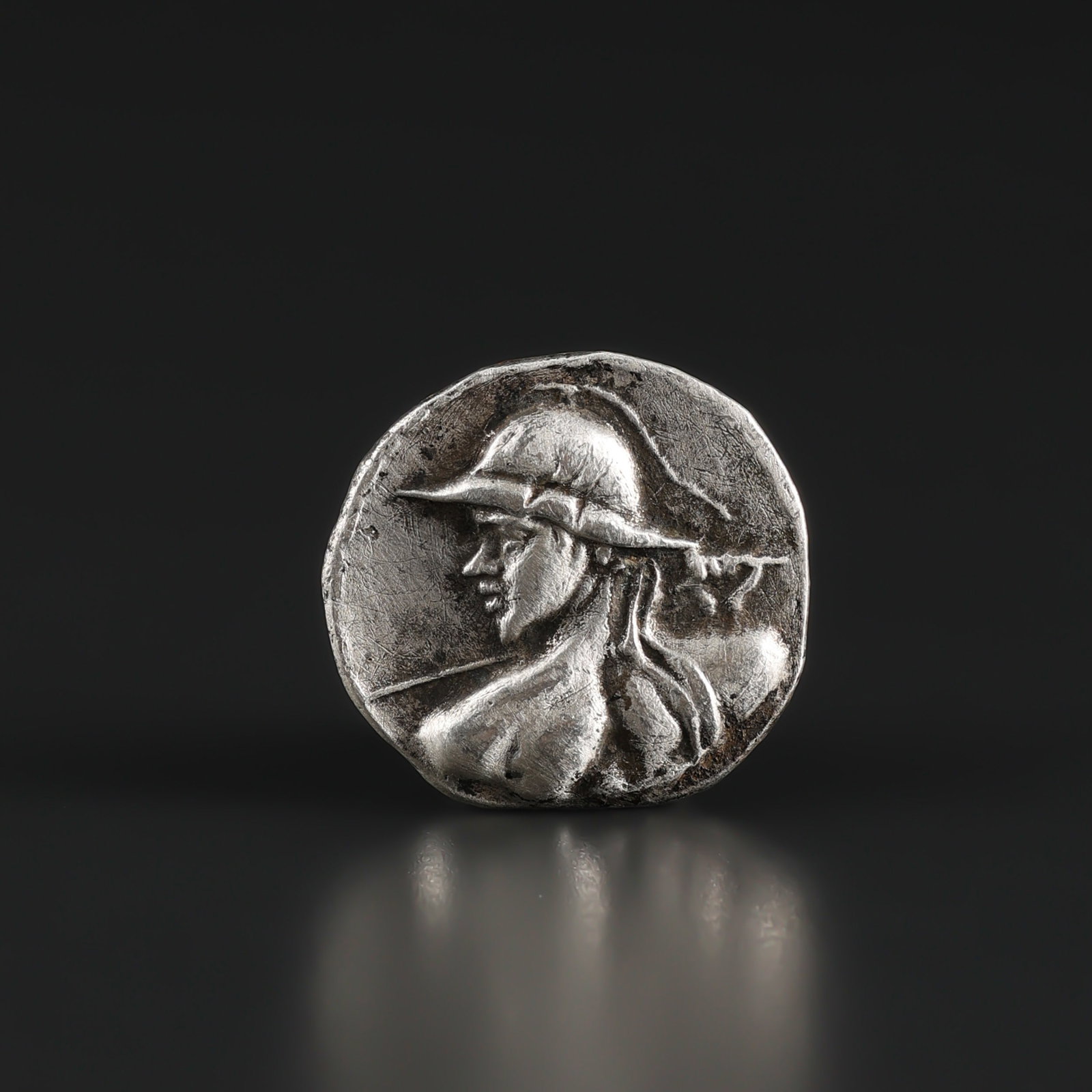 Ancient Old Indo Greek Silver Coin: Fine Coin Ancient Old Indo Greek Silver Coin. A desirable auction piece displaying quality workmanship and collectible character. Well suited for ancient coin and jewelry collectors, display, or addit