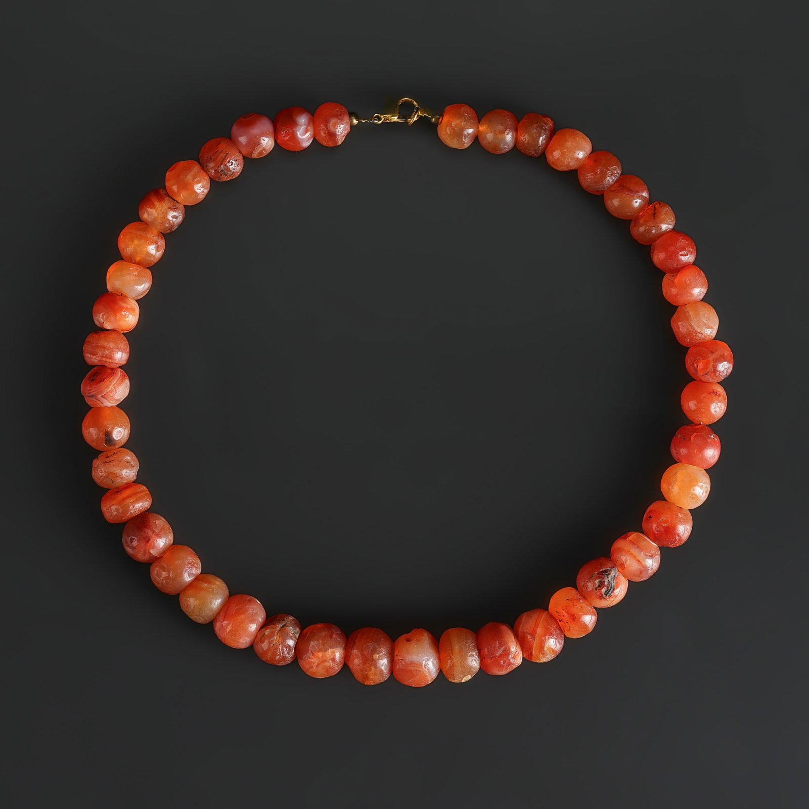 Collection of Antique Old Carnelian Beads Necklace: Collection of Antique Old Carnelian Beads Necklace, featuring selected beads or ornaments with decorative appeal for collectors. Length: 19in Total Weight: 137gram