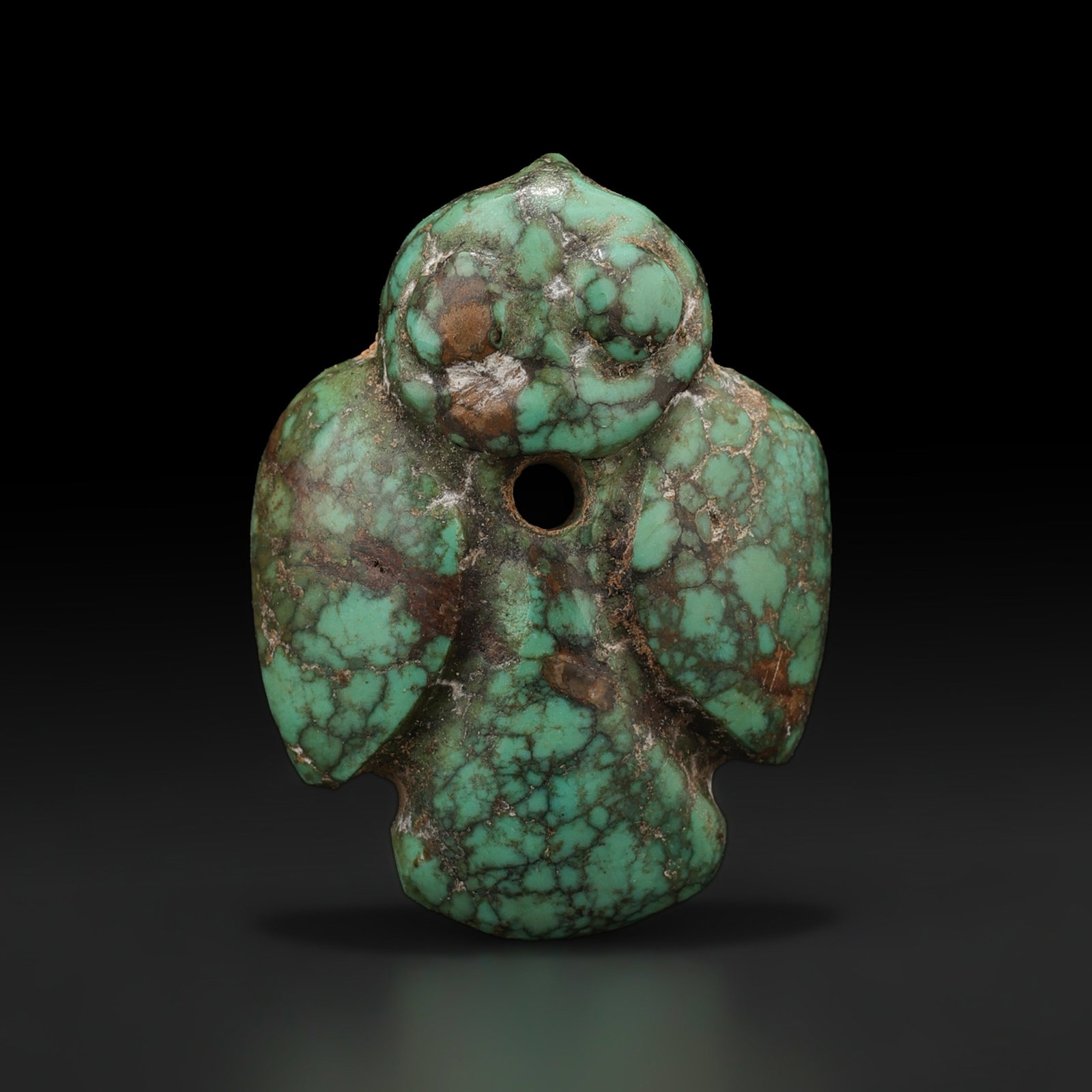 A Turquoise Pendant Depicting a Bird Chinese Shang To Western Zhou Dynasty: A Turquoise Pendant Depicting a Bird Chinese Shang To Western Zhou Dynasty featuring quality craftsmanship and collectible appeal. Suitable for display or collection. Size Detail: 2 x 2.5cm Weight: 5g