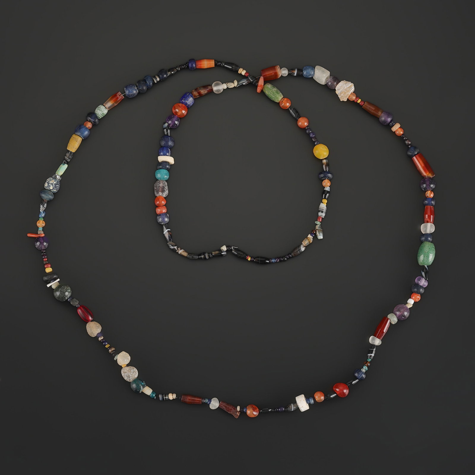 Ancient Roman Multicolored Glass And Agate Bead Necklace: Ancient Roman Multicolored Glass And Agate Bead Necklace featuring quality craftsmanship and collectible appeal. Suitable for display or collection. Length: 32in Total Weight: 27gram
