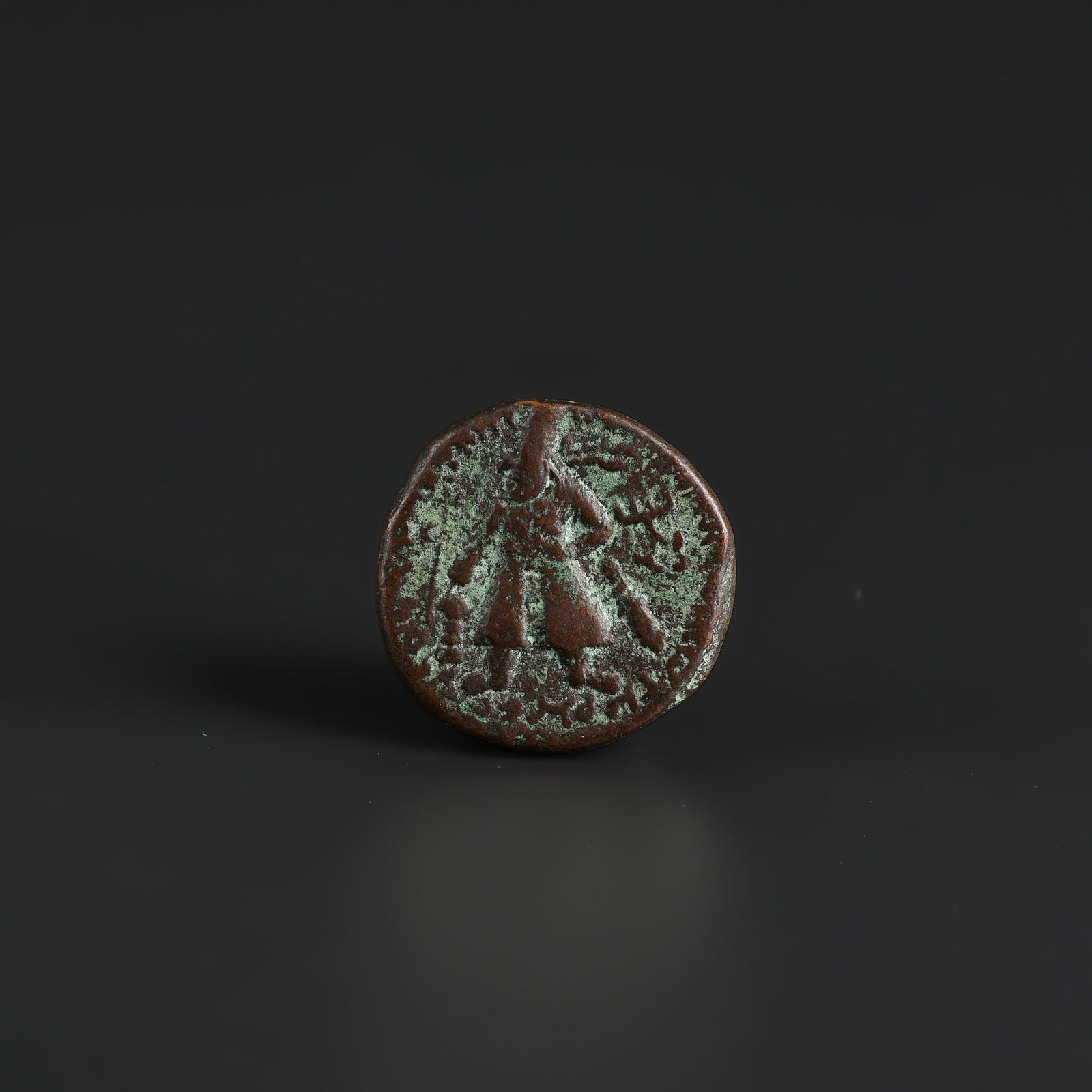 Antique Indo Greek Kushan Bronze Old Coin: Antique Indo Greek Kushan Bronze Old Coin featuring quality craftsmanship and collectible appeal. Suitable for display or collection. Size Detail: ?2.7cm Weight: 16gram
