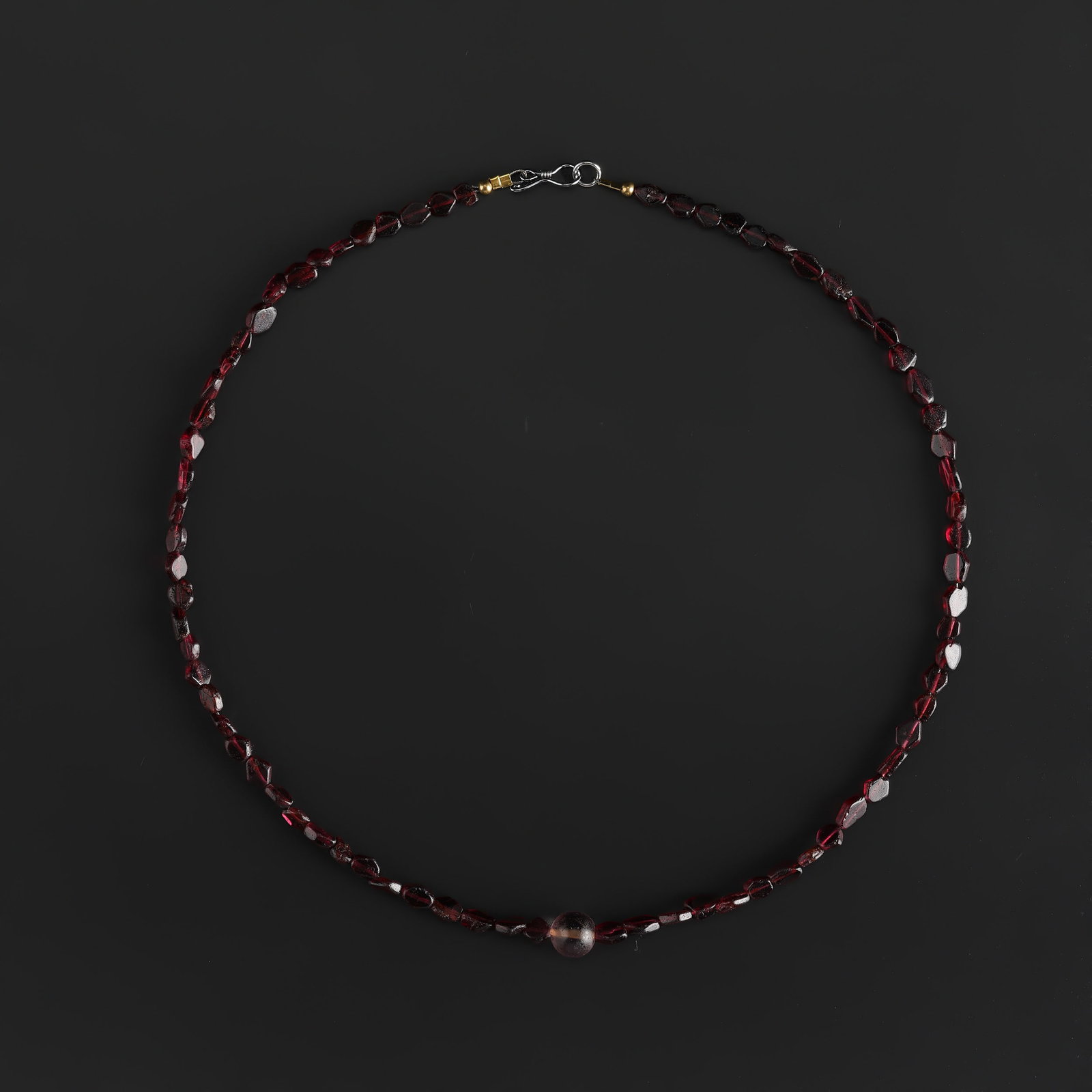 Collection of Vintage Garnet Jewelry Beads with Crystal Bead Pendant Necklace: Collection of Vintage Garnet Jewelry Beads with Crystal Bead Pendant Necklace features a combination of beads and jewelry elements arranged as a wearable necklace. It has an antique-style appearance a