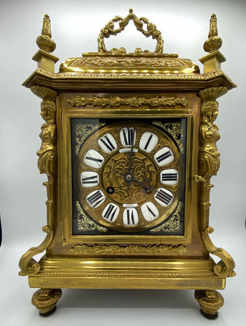 Antique French Lerolle Freres Paris Gilt Bronze Clock: French Lerolle Freres Clock. The fancy 5 1/2" gilt metal dial has individual porcelain on metal Roman numerals. The early style case has female figures on all four corners.