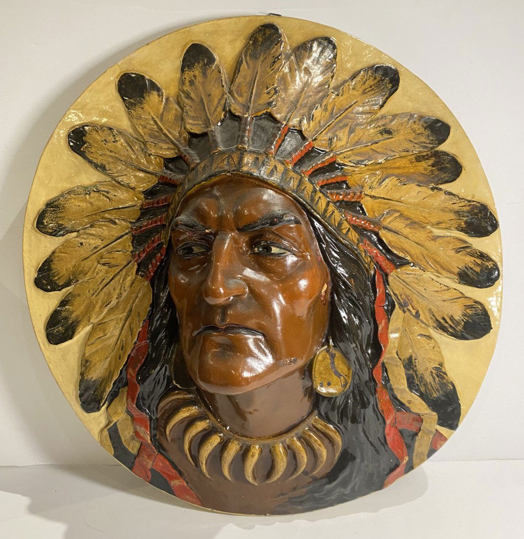 Antique Native American Indian Round Relief Wall Plaque: Antique Native American Indian Round Relief PlaquePlaque is made of composition material, possibly plaster. Nice cigar shop memorabilia.