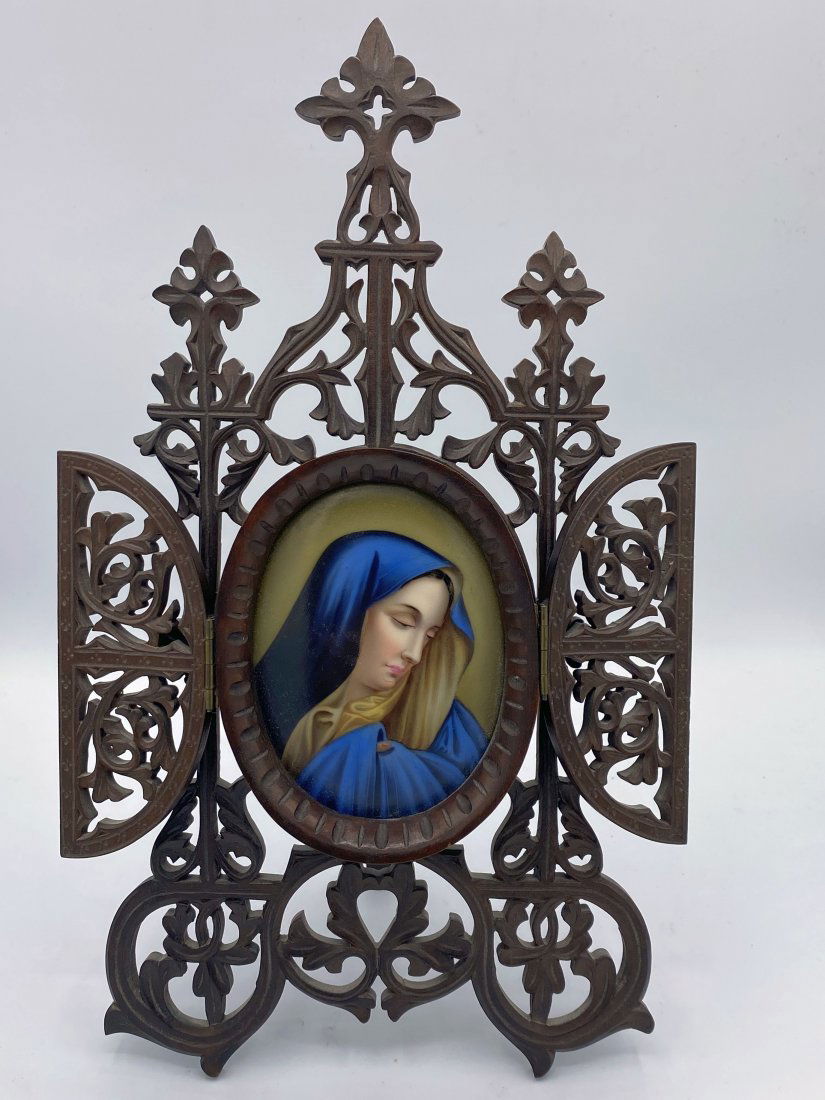 Porcelain Hand Painted Plaque Virgin Mary Carved Frame: German Porcelain Hand Painted Plaque of Virgin Mary. Possibly KPM or Hutschenreuther. Features an oval porcelain plaque hand painted with the image of Mary. Framed in an ornately carved wooden frame w
