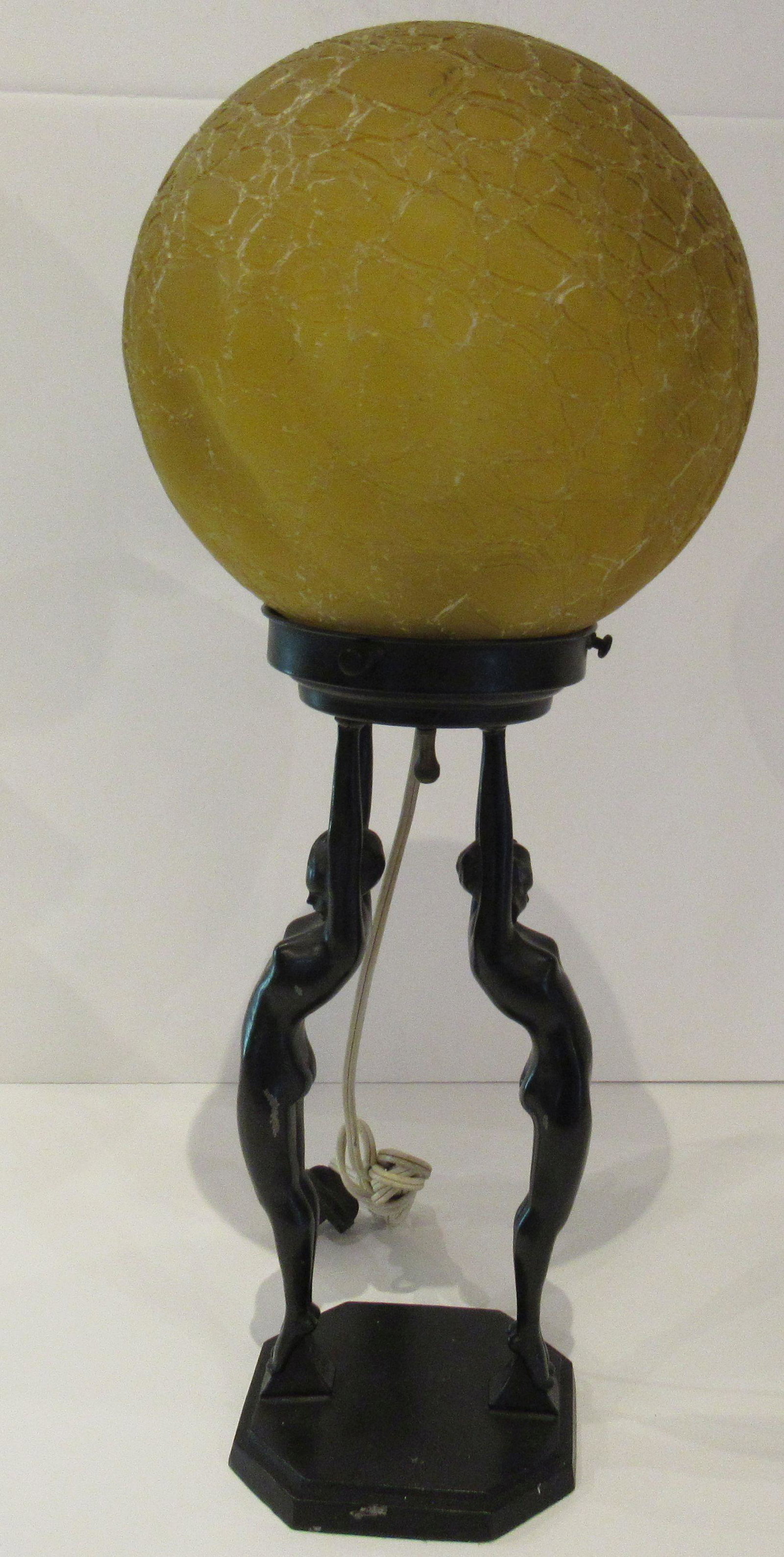 Art Deco Frankart Lamp Amber Crackle Glass Shade: Antique Art Deco Frankart, ca. 1920s table lamp. Amber crackle glass globe lamp. Two nude women holding up globe. Patent D 77201.