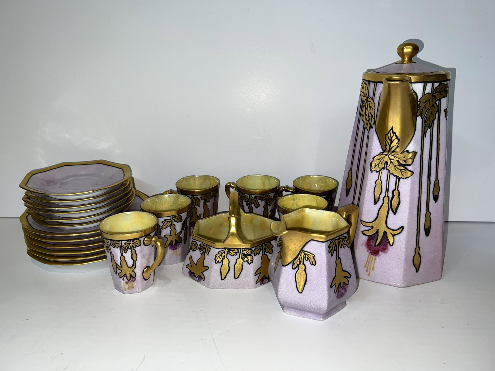Antique Schwarzburg Limoges Gilt Art Nouveau China Set: Antique Schwarzburg Limoges Gilt China Chocoloate Set. Beautiful hand painted Art Nouveau gold decorations on purple background.