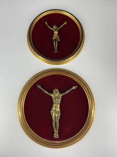 Lot of 2 Antique Bronze Jesus Crosses: Lot of 2 Antique Bronze Jesus Crucifixes on Red Satin; Round frame; Approximate diameters: 11.5" & 14"