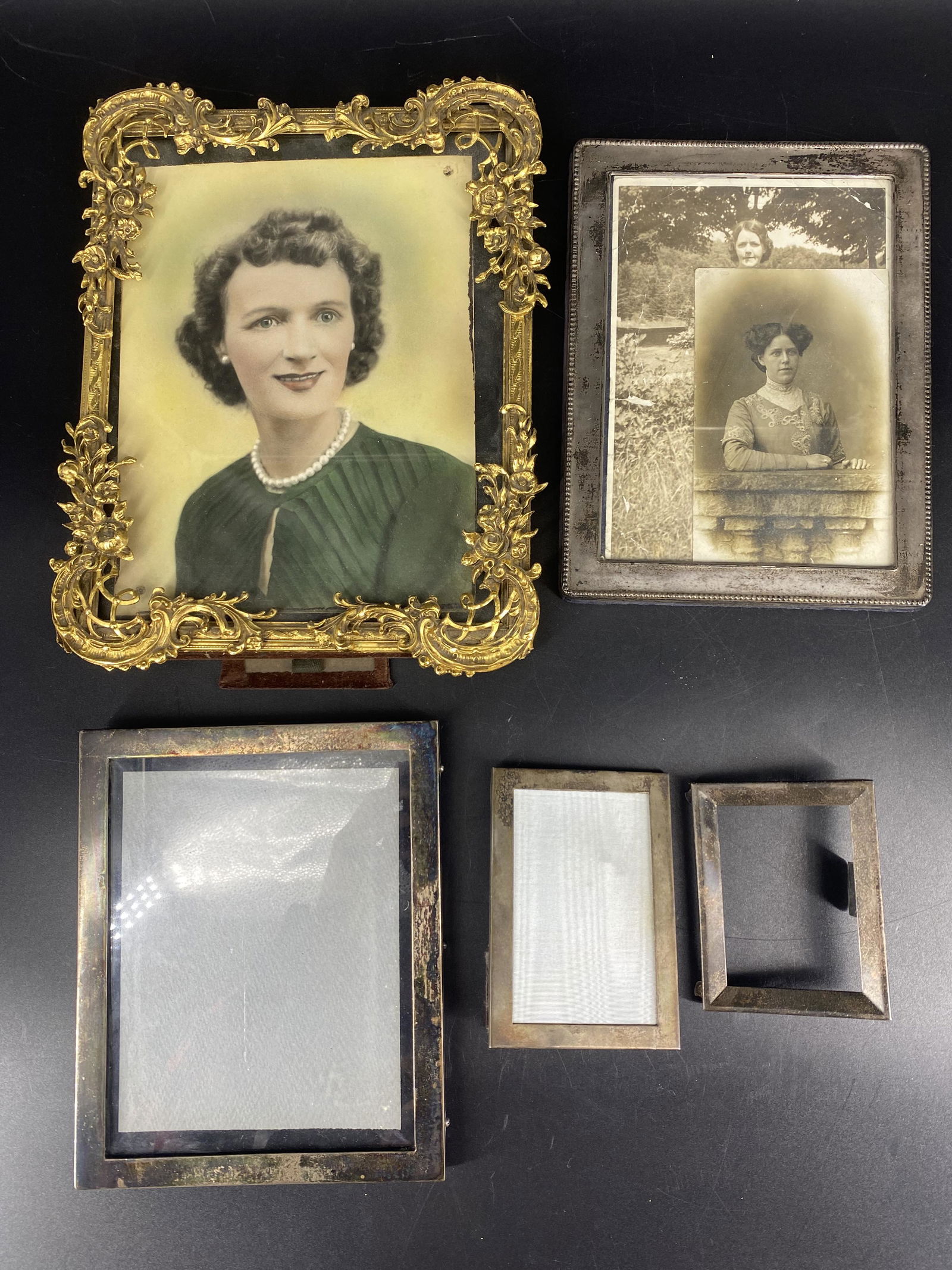 Lot of 5 Antique Photo Picture Frames Sterling Silver Brass: Lot of 5 antique photo picture frames. 4 sterling silver frames each measuring at approx. 4.5" x 3.25", 7.65" x 6.25", 8.35" x 6.35", and one frame by Tiffany & Co. measuring at approx. 4"H x 3"W. One