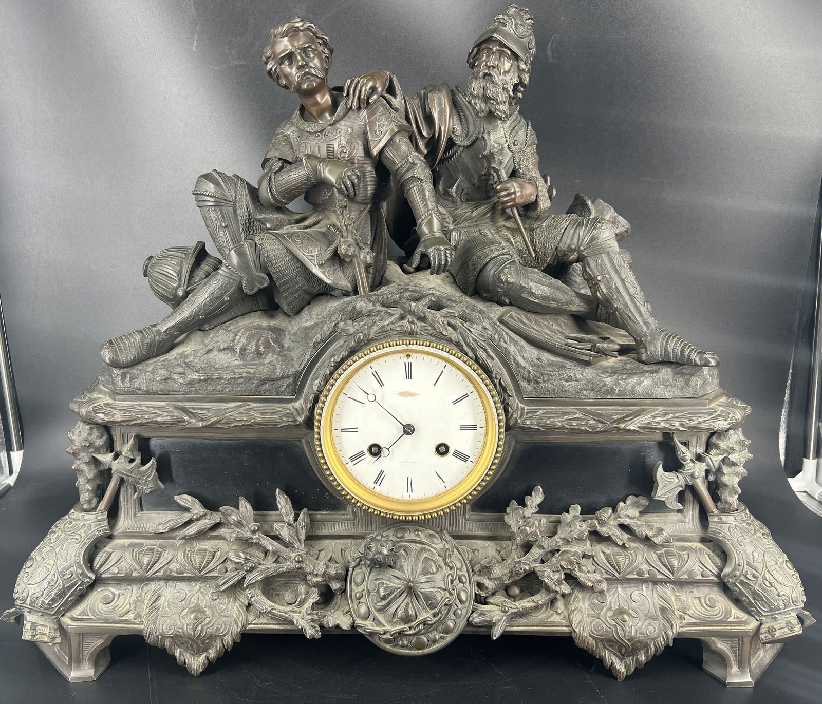 Fine Antique Patinated Bronze Sculpture Mantel Clock Tiffany & Co.: Fine Antique Monumental Bronze Sculpture Mantel Clock Retailed by Tiffany & Co. Modeled as Medieval Knights & Warriors resting on top of the clock. Superb casting quality. Approximate size: 20 inches