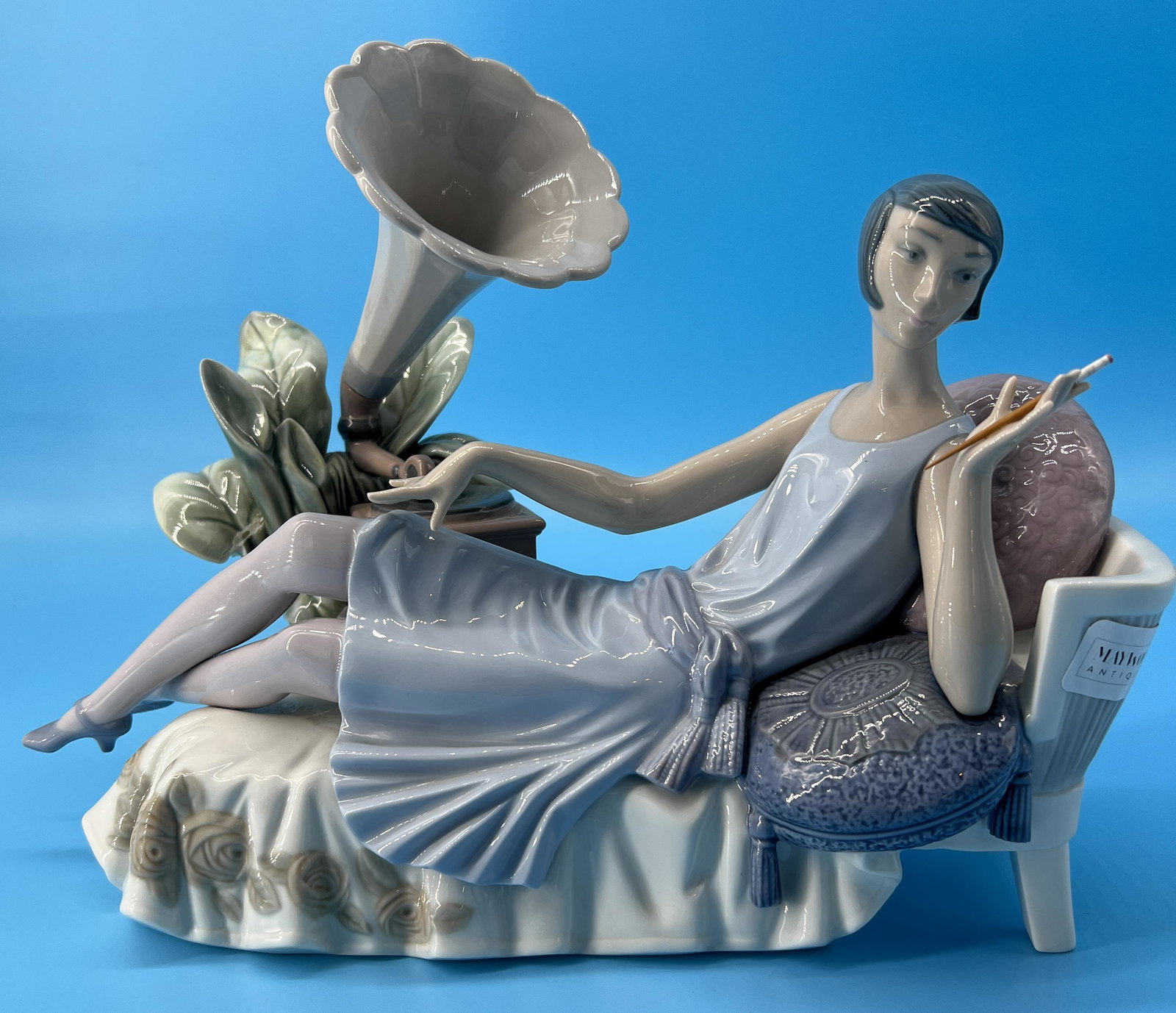 Vintage Lladro Spain Porcelain Figurine #5176 'Lady Lying on Divan' Phonograph: Lladro Spanish glazed porcelain figure depicting a reclining female on divan with gramophone titled "Lady Lying on Divan" or "Fumando Espero" number 5176. Sculpted by Vincente Martinez. Issued in 1982