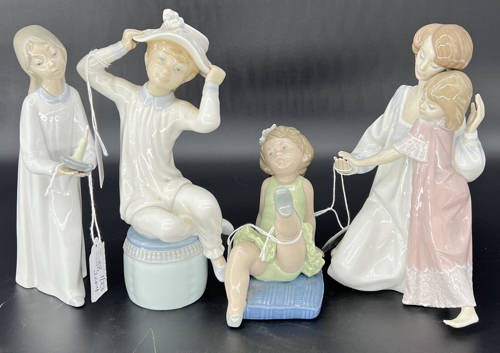 Vintage Lladro Spain Lot of 4 Porcelain Figurines: Vintage Lladro Spain Lot of 4 Porcelain Figurines. Includes #4868 "Girl With Candle,' #1147 'Girl With Hat,' #5108 'Little Ballerina Girl,' and #5449 Mother & Daughter. Signed on bottom. No chips or c