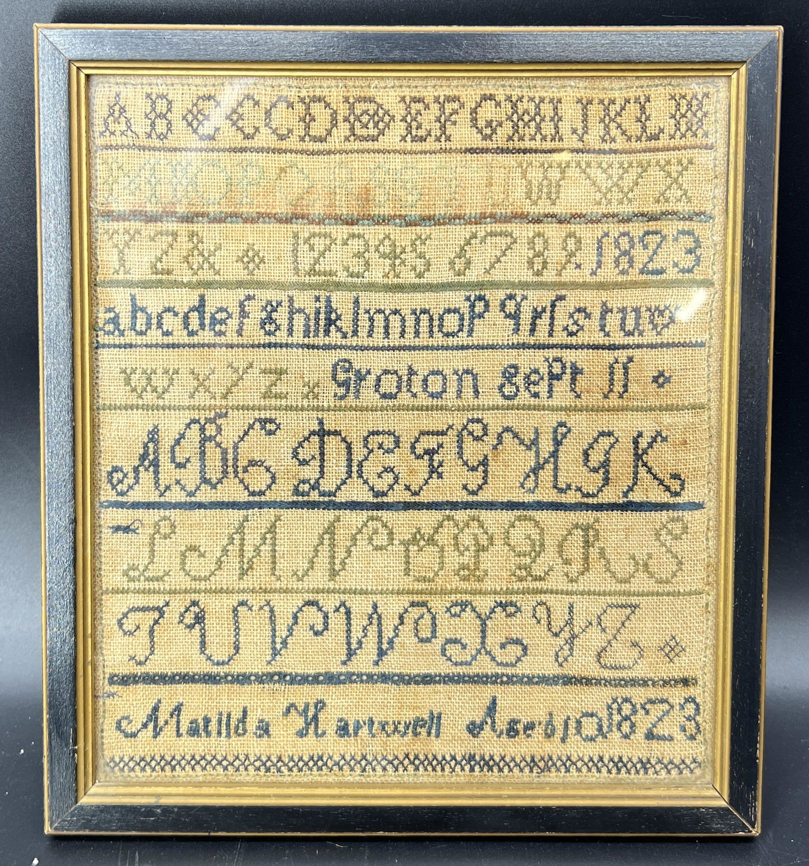 Antique Primitive Framed Sampler 1823 Matilda Hartwell Aged 10: Antique primitive sampler. Dated to 1823. Made by a Matilda Hartwell, aged 10. Alphabet, numbers, and date. Size: 10" x 10.75" x 2".