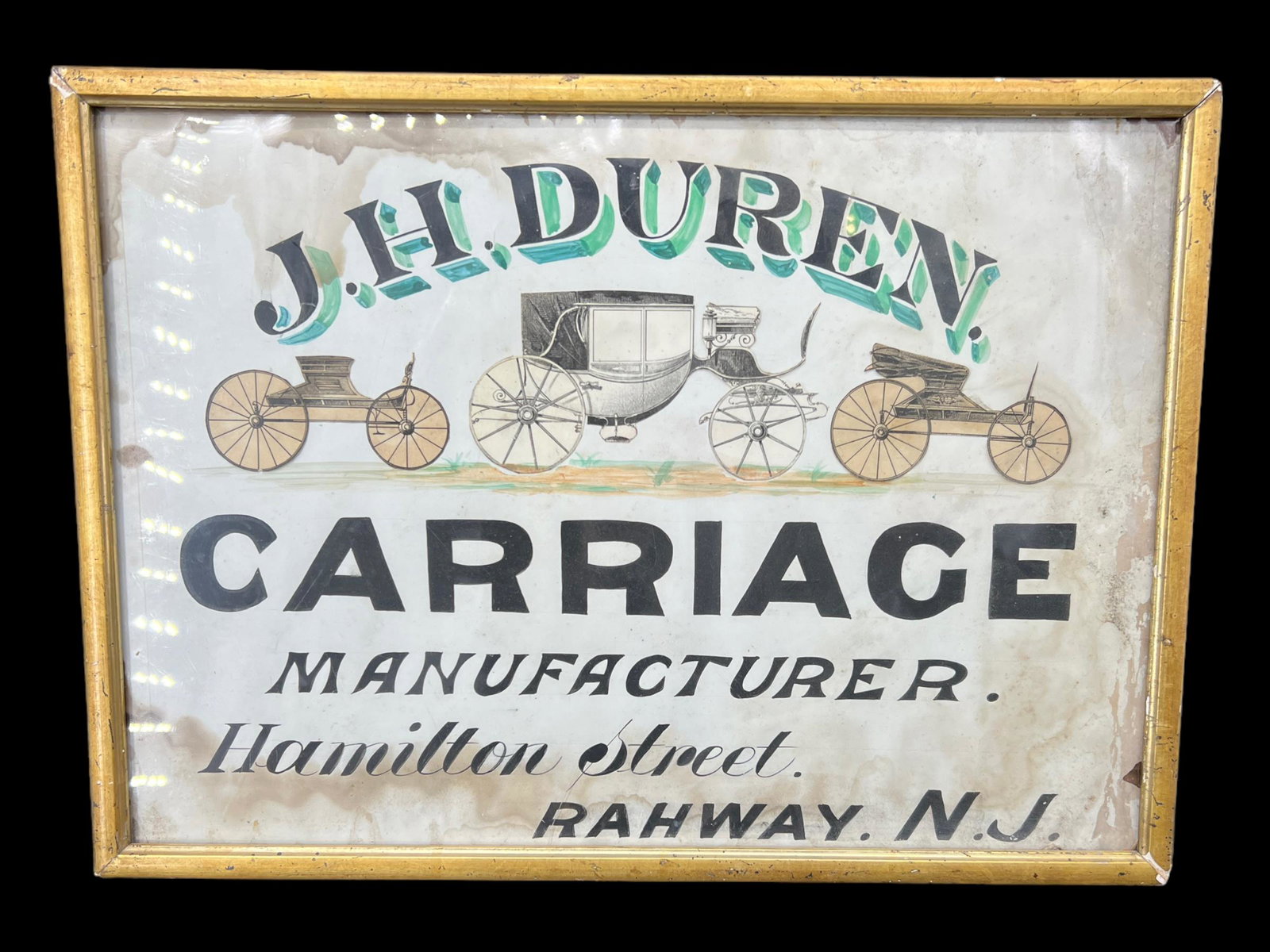 Antique J.H Duren Carriage Manufacturer Rahway, N.J Advertising Framed Poster: Framed advertising poster for the J.H Duren Carriage Manufacturer that was on Hamilton Street in Rahway, N.J. Framed. Wooden backed frame. Size: 16.5" x 12". Some water damage to the piece.