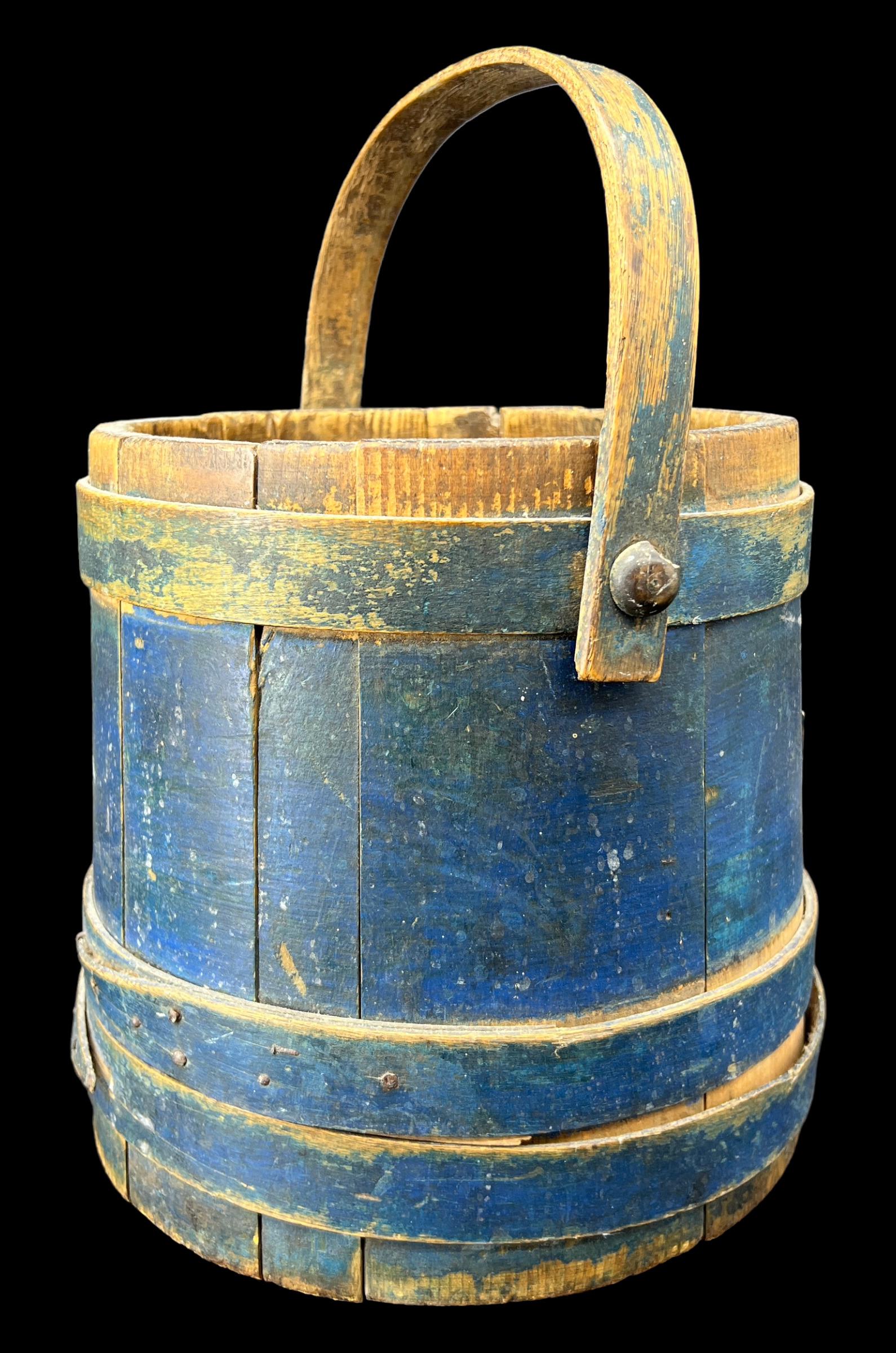 Antique Primitive Wooden Maple Sap Bucket Painted Blue: Early primitive sap bucket. Made of wood. Wooden bands and handle. Painted a deep cobalt blue. Milk paint. Bentwood. Size: 9.75" x 9". There is no lid.
