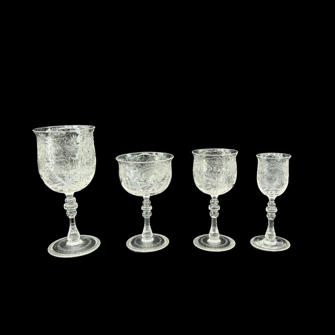 Antique Thomas Webb & Sons British English Cut Crystal 39 Piece Glass Set: Antique cut crystal Thomas Webb stemware set. (12) footed water goblets: 7.25" tall. (9) Wine goblets: 5.75". (10) Champagne Goblets (5.5"). (8) Cordials (5.25"). 39 pieces total. Signed on bottoms. O