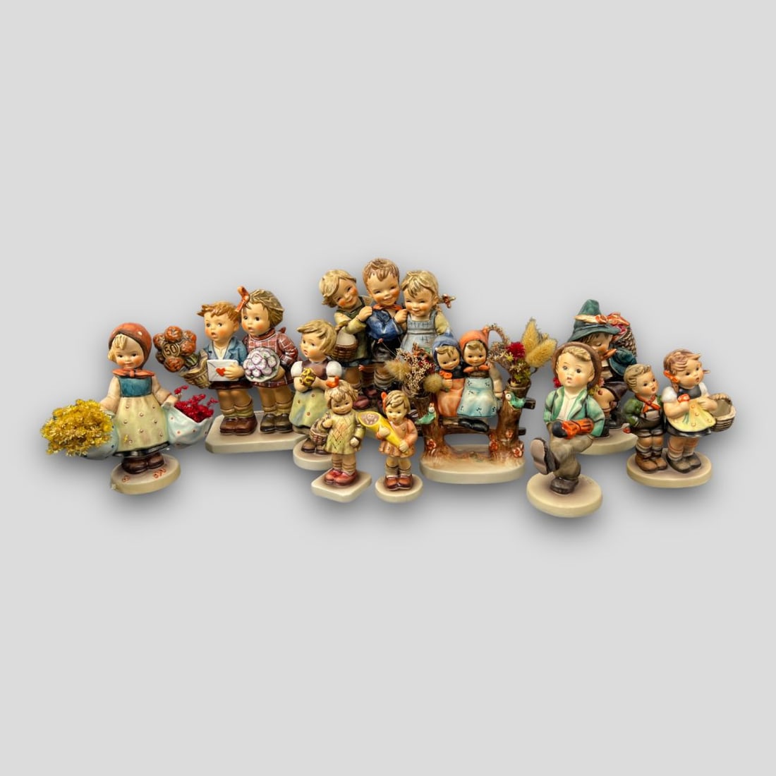 Antique Lot of 10 Hummel Porcelain Figurines: Antique Lot of 10 Hummel Figurines. #381 Flower Vendor, #49/0 To Market, #479 I Brought You A Gift, #549 A Sweet Offering, #109 Happy Traveler, #179 Coquettes, #57 Mother's Darling, #257/0 For Mother,