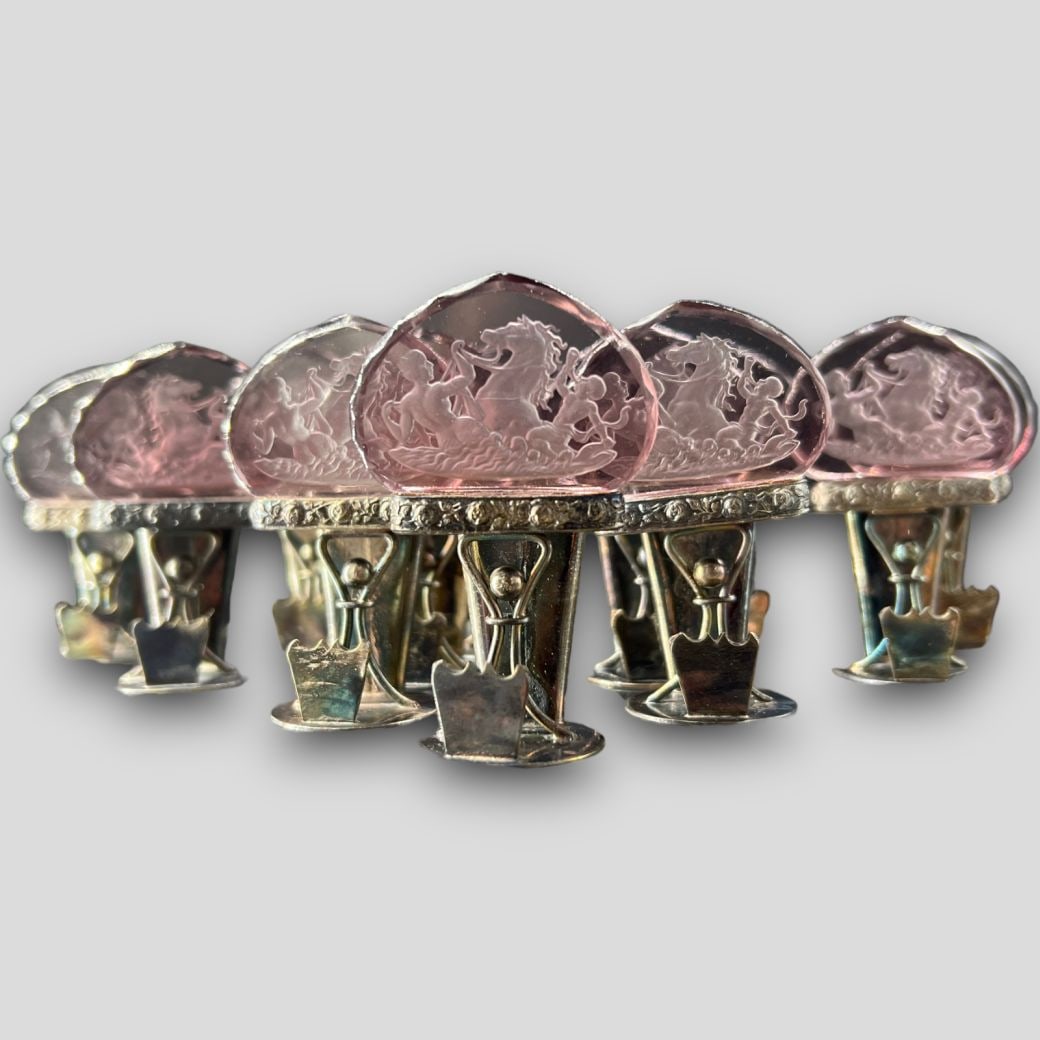 Antique Intaglio Moser Purple Glass Austrian Placecard Holders: Antique Intaglio Moser Purple Glass Austrian Placecard Holders. Signed Made in Austria on the bottom. Glass has carved horse with man and woman next to horse. Approximate size: 2.5'' x 1.5'' x 1.5''