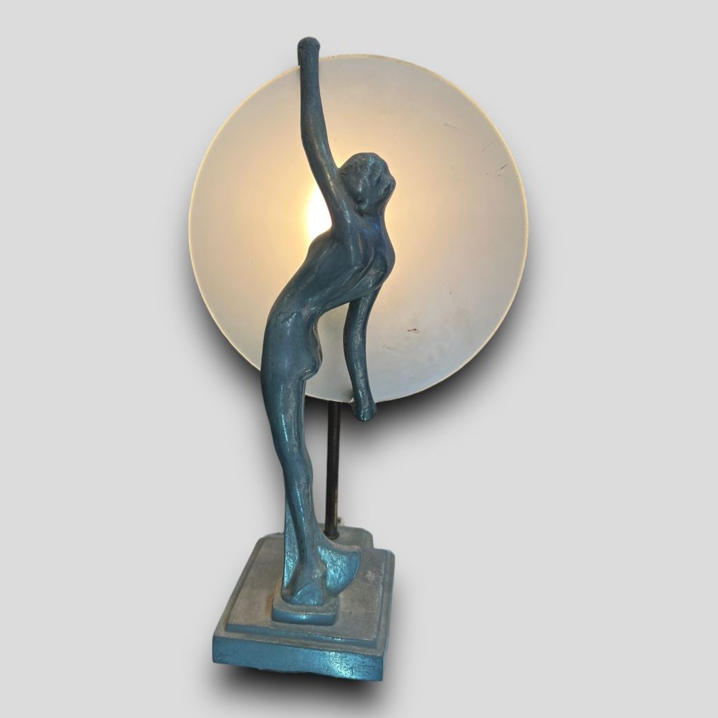 Vintage Nude Art Deco Woman Holding Disc Lamp: Vintage Nude Art Deco Woman Holding Disc Lamp. The lamp is unsigned. There are no chips or cracks to the disc. Working. Approximate size: 14'' x 8'' x 5.75''