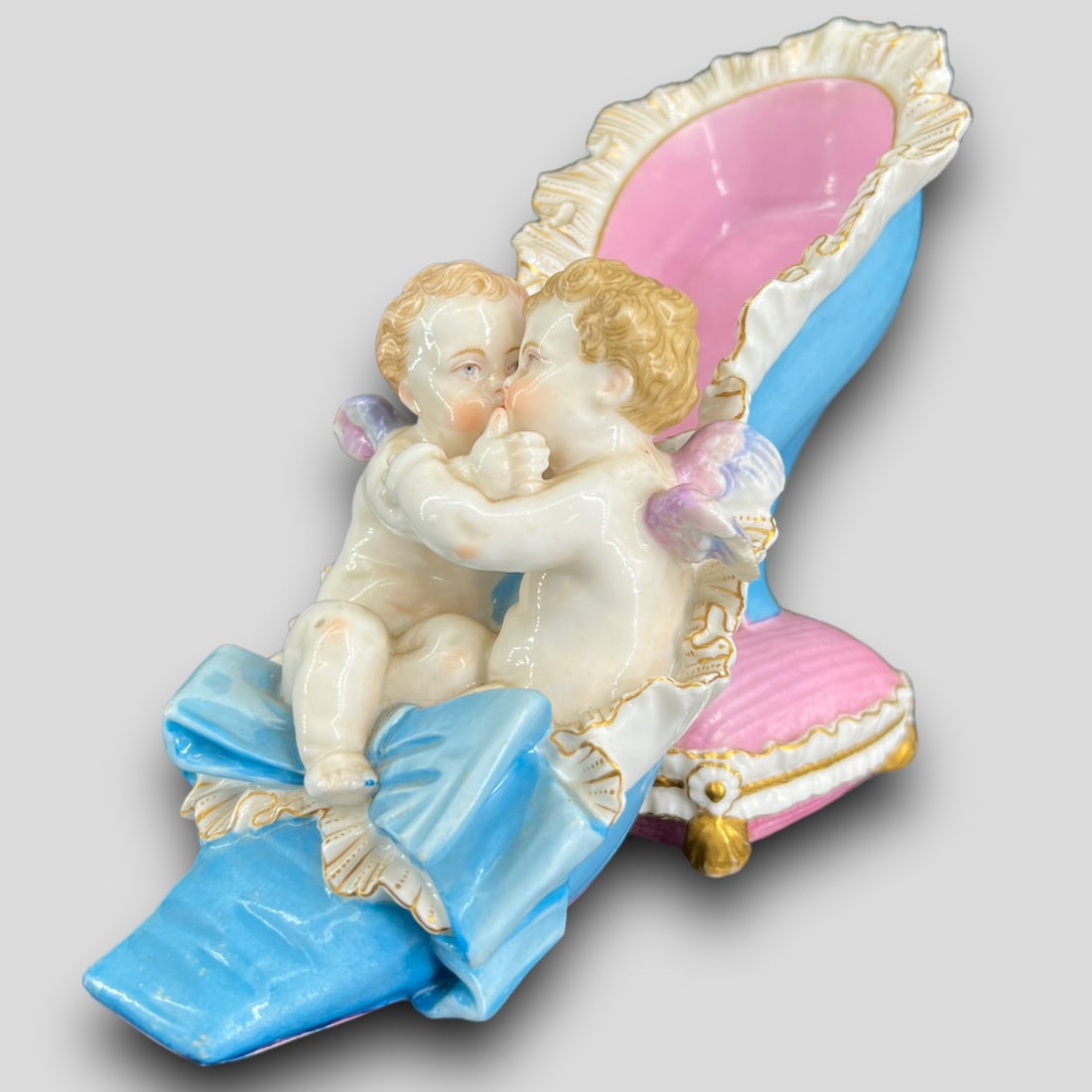 Antique Meissen German Porcelain Shoe W/ Two Cherub Angels: Antique Meissen German Porcelain Shoe W/ Two Cherub Angels. Cross swords Meissen mark on the bottom. Chips on the lace.