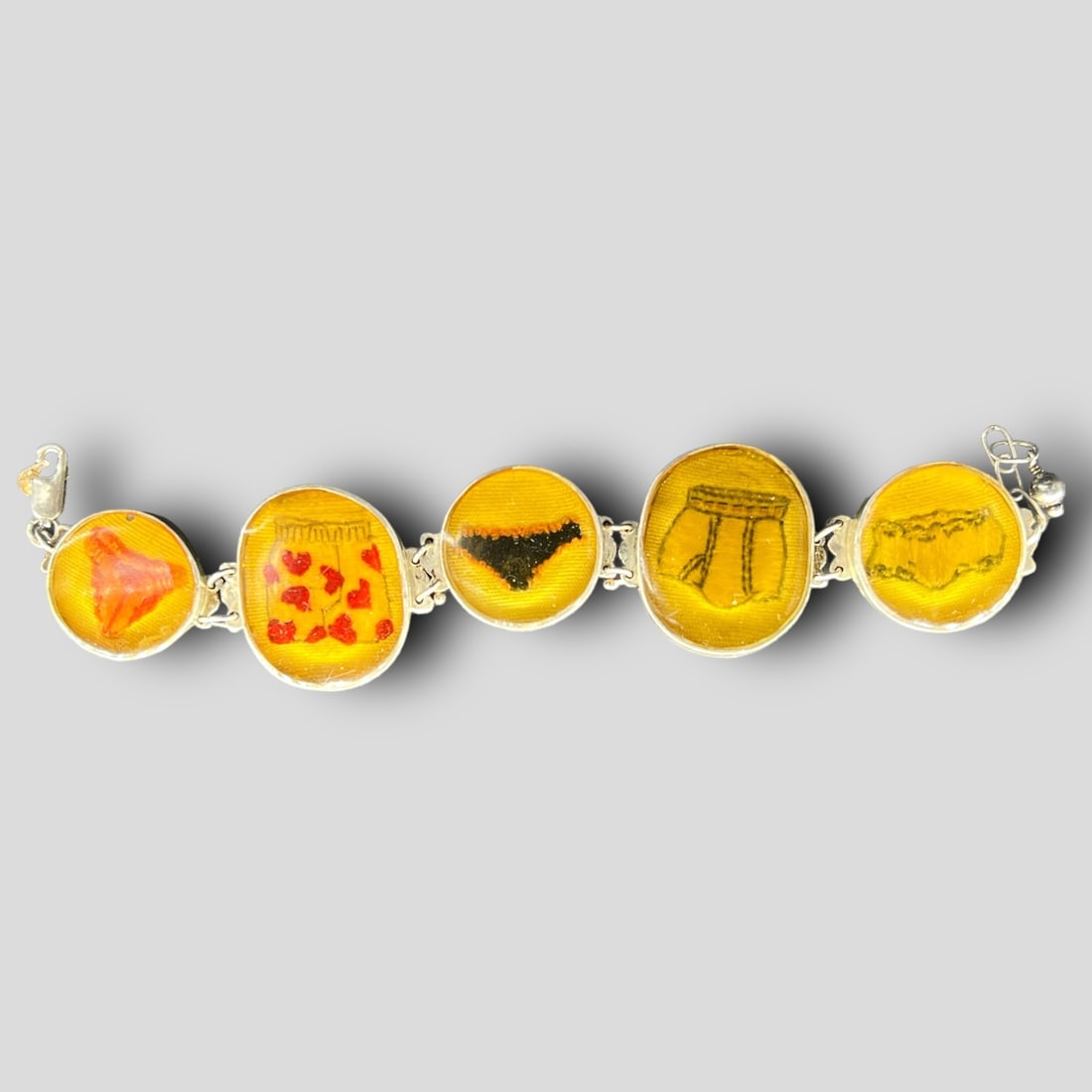 Vintage Marina Marioni Sterling Silver Underwear Thong Bracelet: Vintage Marina Marioni Sterling Silver Underwear Thong Bracelet. Signed on the back. Includes Granny Panty's, Tighty Whiteys, Bikini, Boxers, Thong. Marked Marioni Sterling on the back of the Thong ch