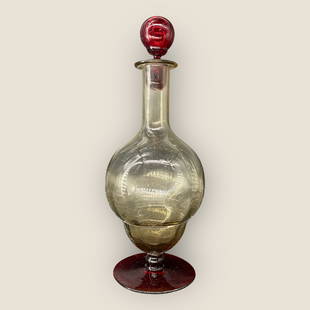 Antique Pauly & Co Murano Venezia Italian Art Glass Decanter: Antique Pauly & Co Venezia Italian Art Glass Red Footed Decanter. Approx. Dimensions: 12"H x 4.5"W. Paper label on the bottom.